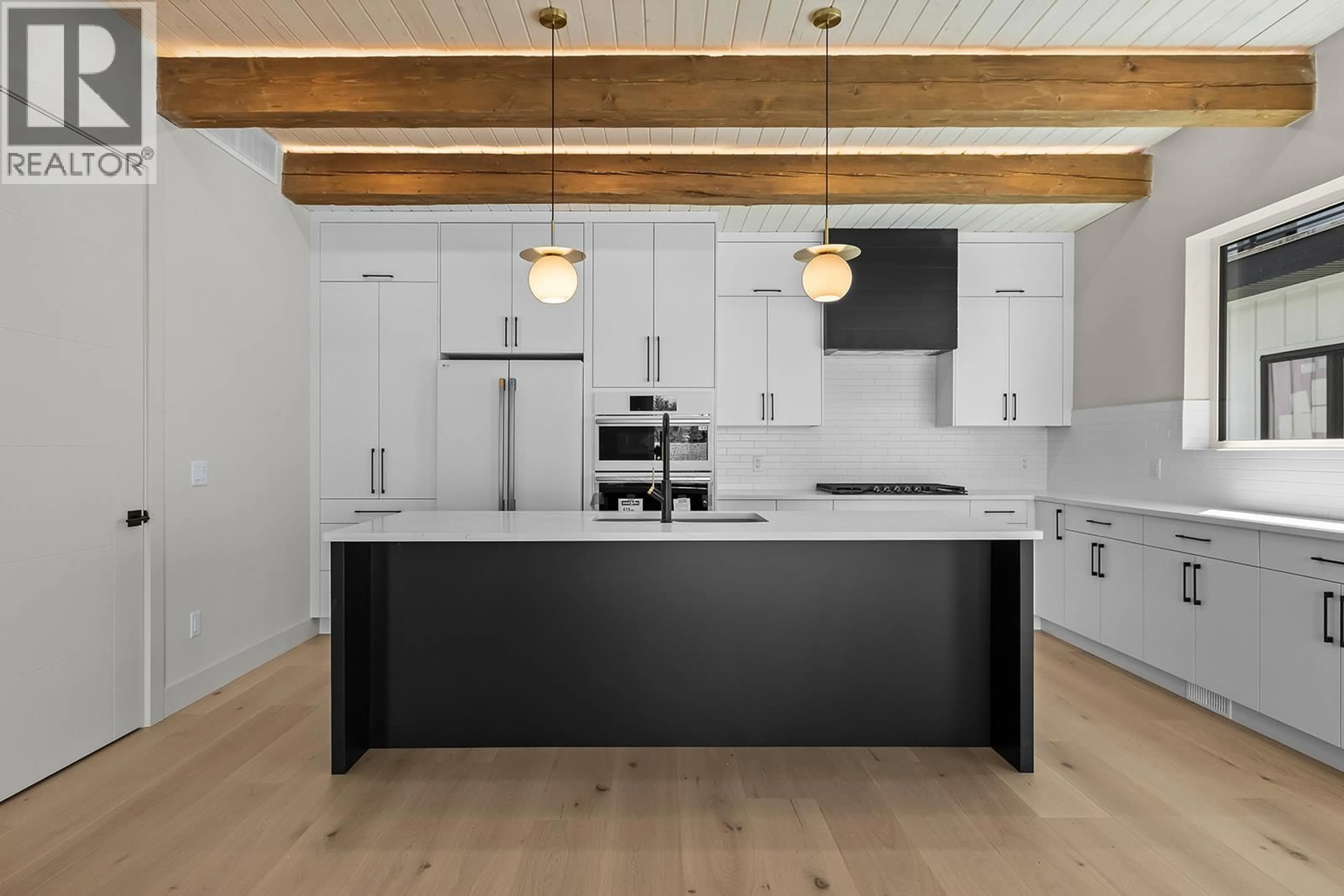 Contemporary kitchen, wood/laminate floor for 2 - 4495 WALKER ROAD, Kelowna British Columbia V1W1G8