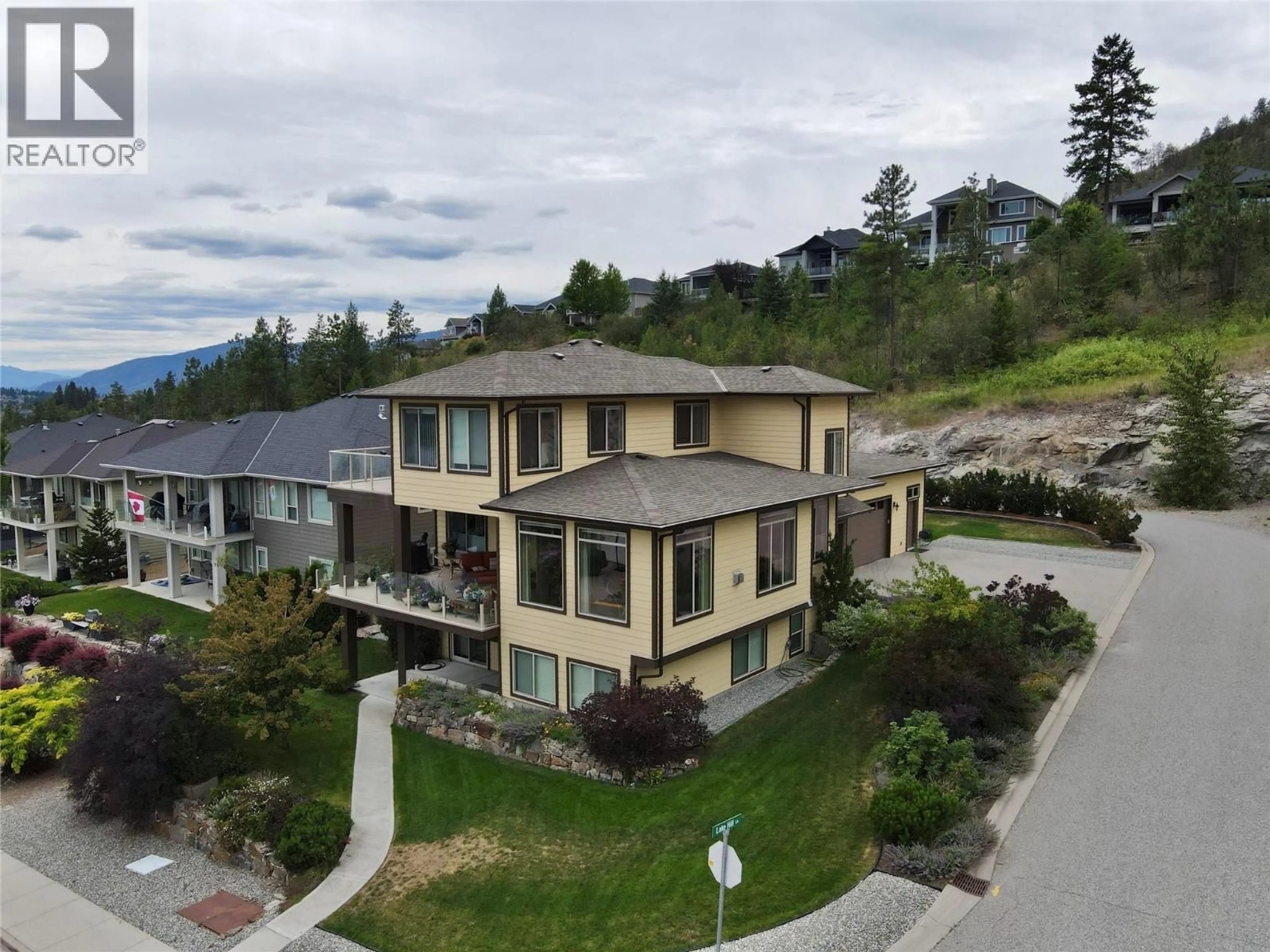 A pic from outside/outdoor area/front of a property/back of a property/a pic from drone, mountain view for 13492 LAKE HILL WAY, Lake Country British Columbia V4V2S7