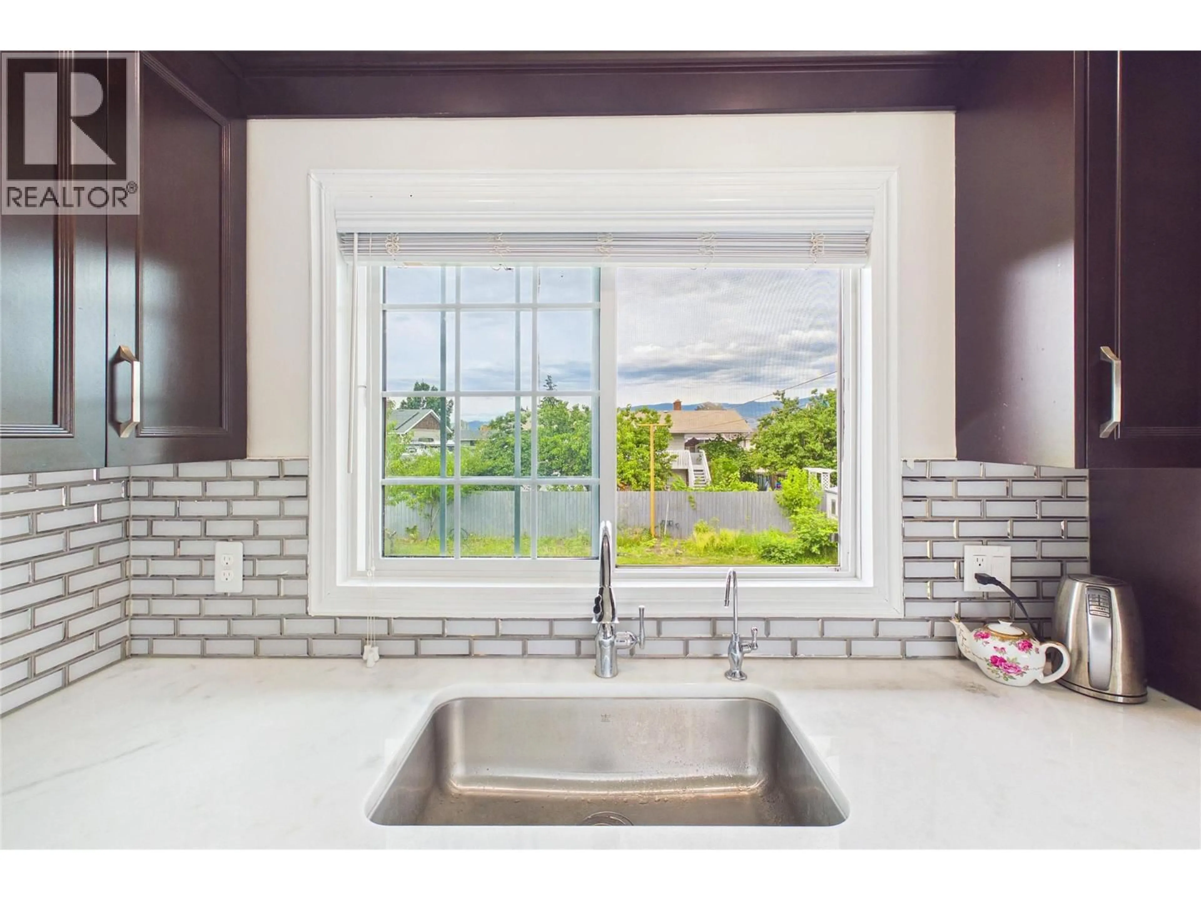 Contemporary kitchen, ceramic/tile floor for 610 ZIPRICK ROAD, Kelowna British Columbia V1X5R5