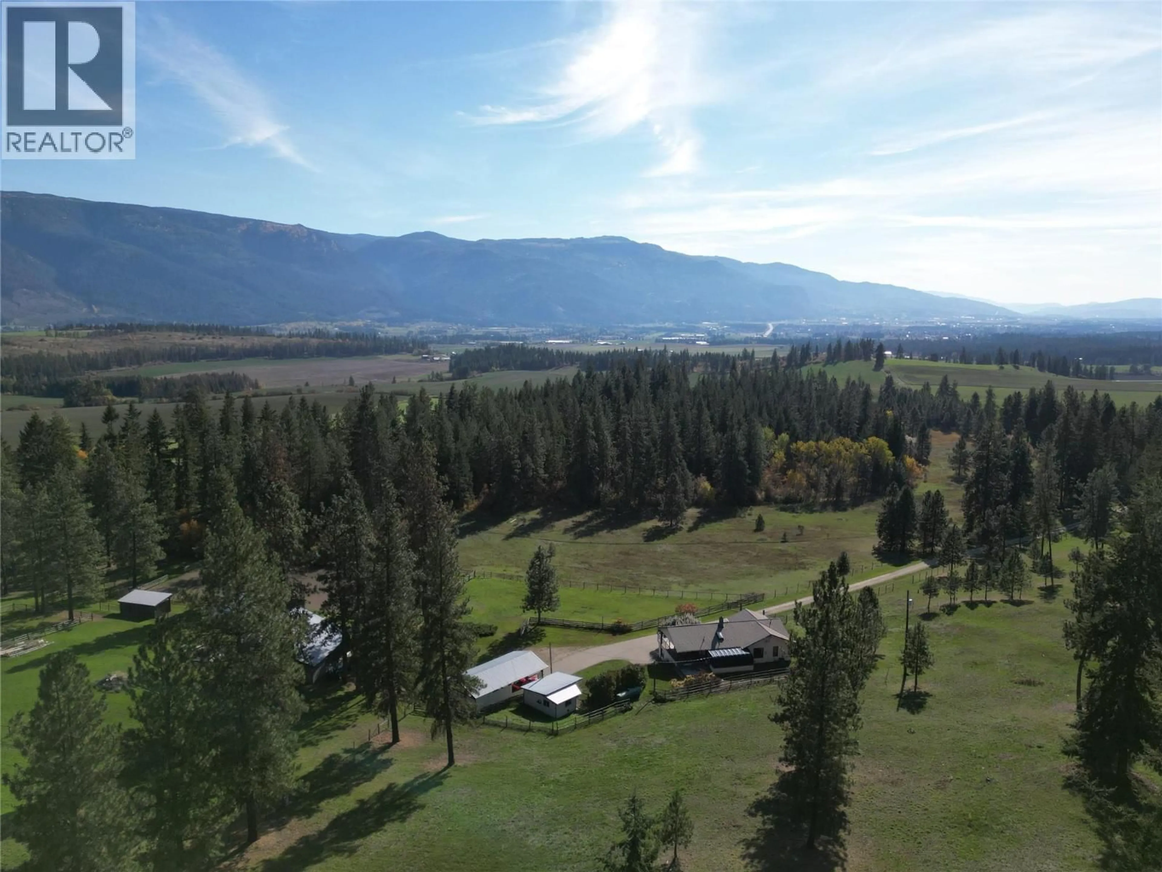A pic from outside/outdoor area/front of a property/back of a property/a pic from drone, mountain view for 2150 RASHDALE ROAD, Spallumcheen British Columbia V0E1B4