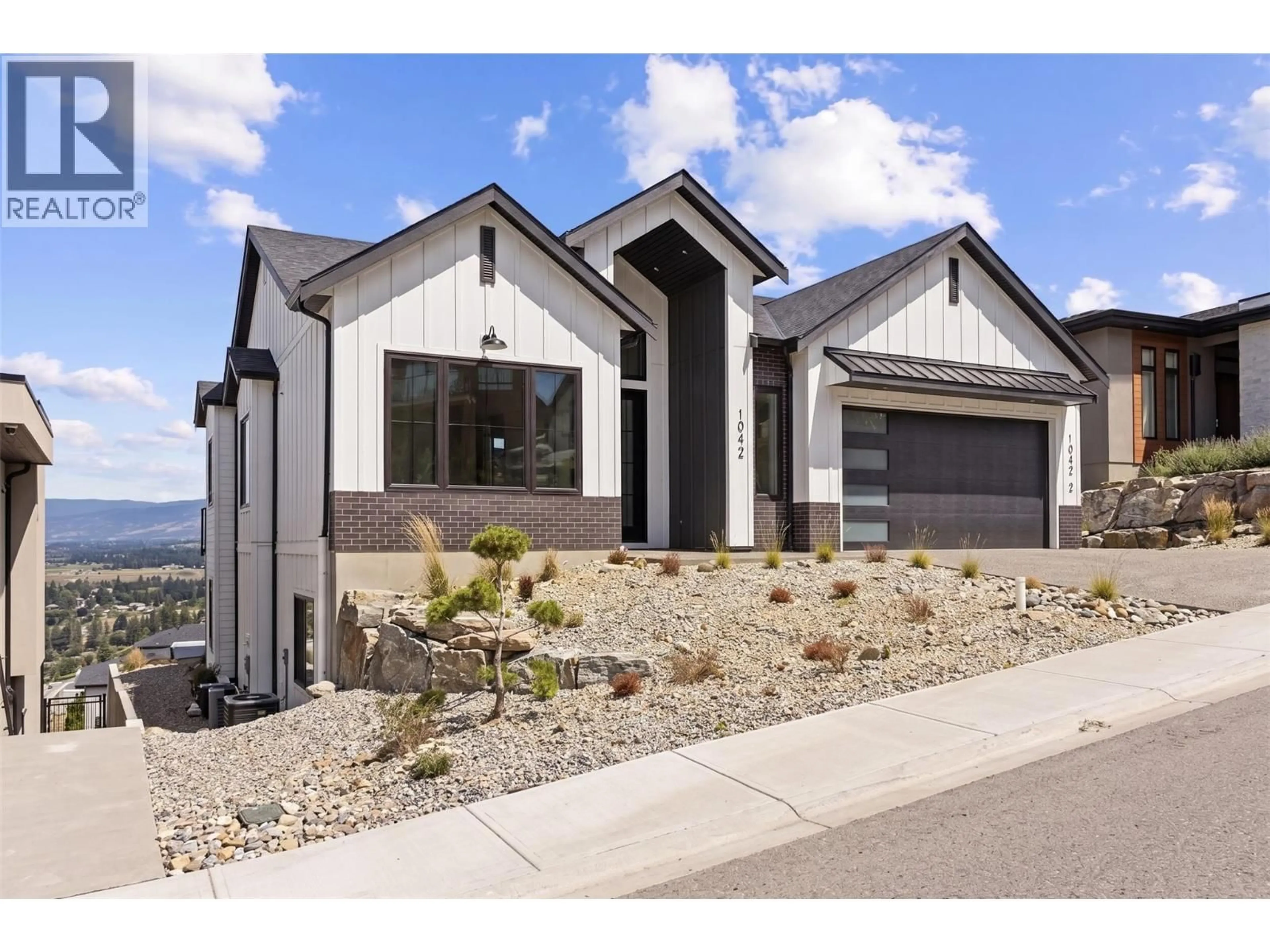 Home with brick exterior material, unknown for 1042 EMSLIE STREET, Kelowna British Columbia V1W0C3