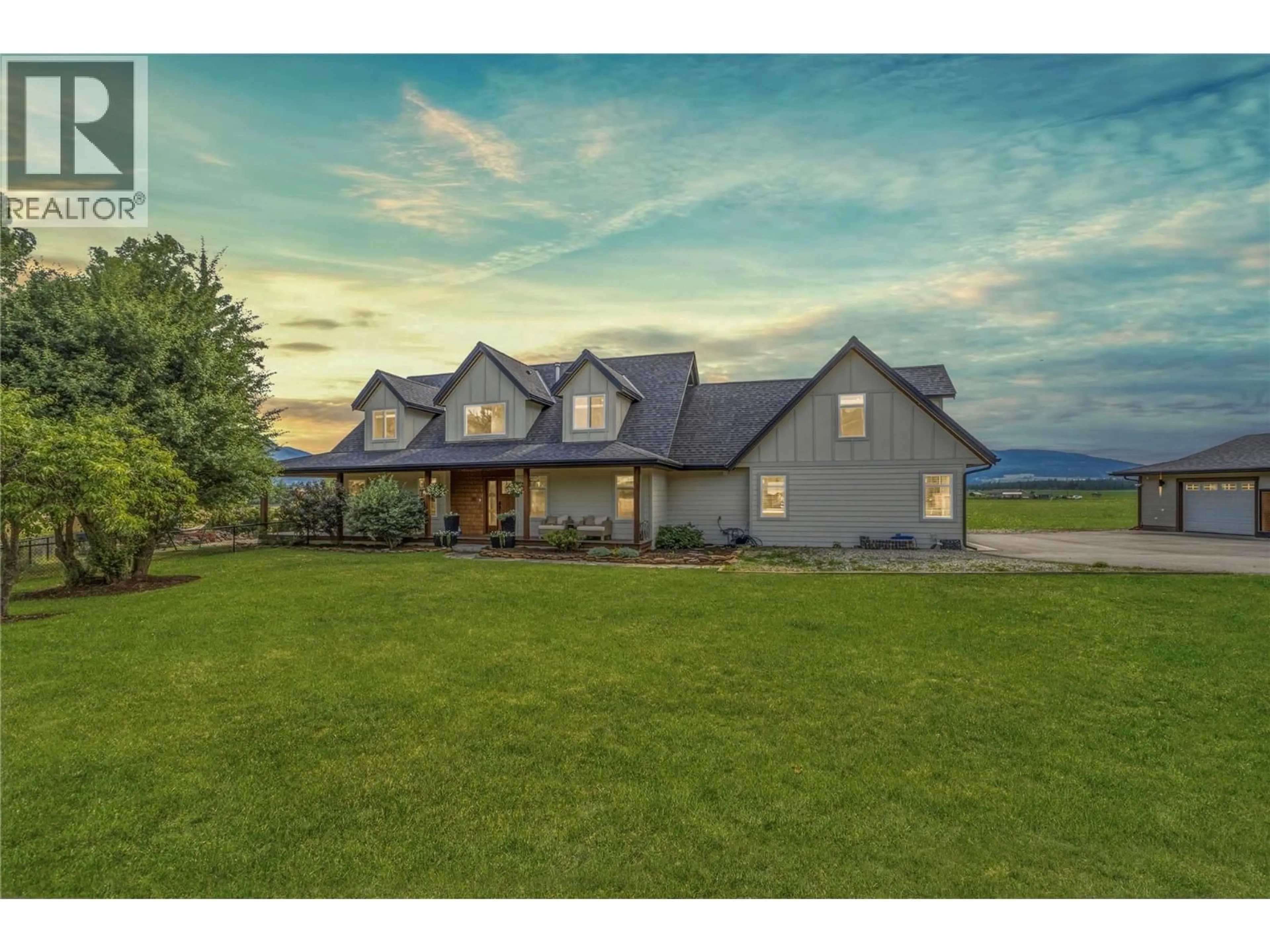 A pic from outside/outdoor area/front of a property/back of a property/a pic from drone, mountain view for 4525 MCLEERY ROAD, Spallumcheen British Columbia V4Y0Y4