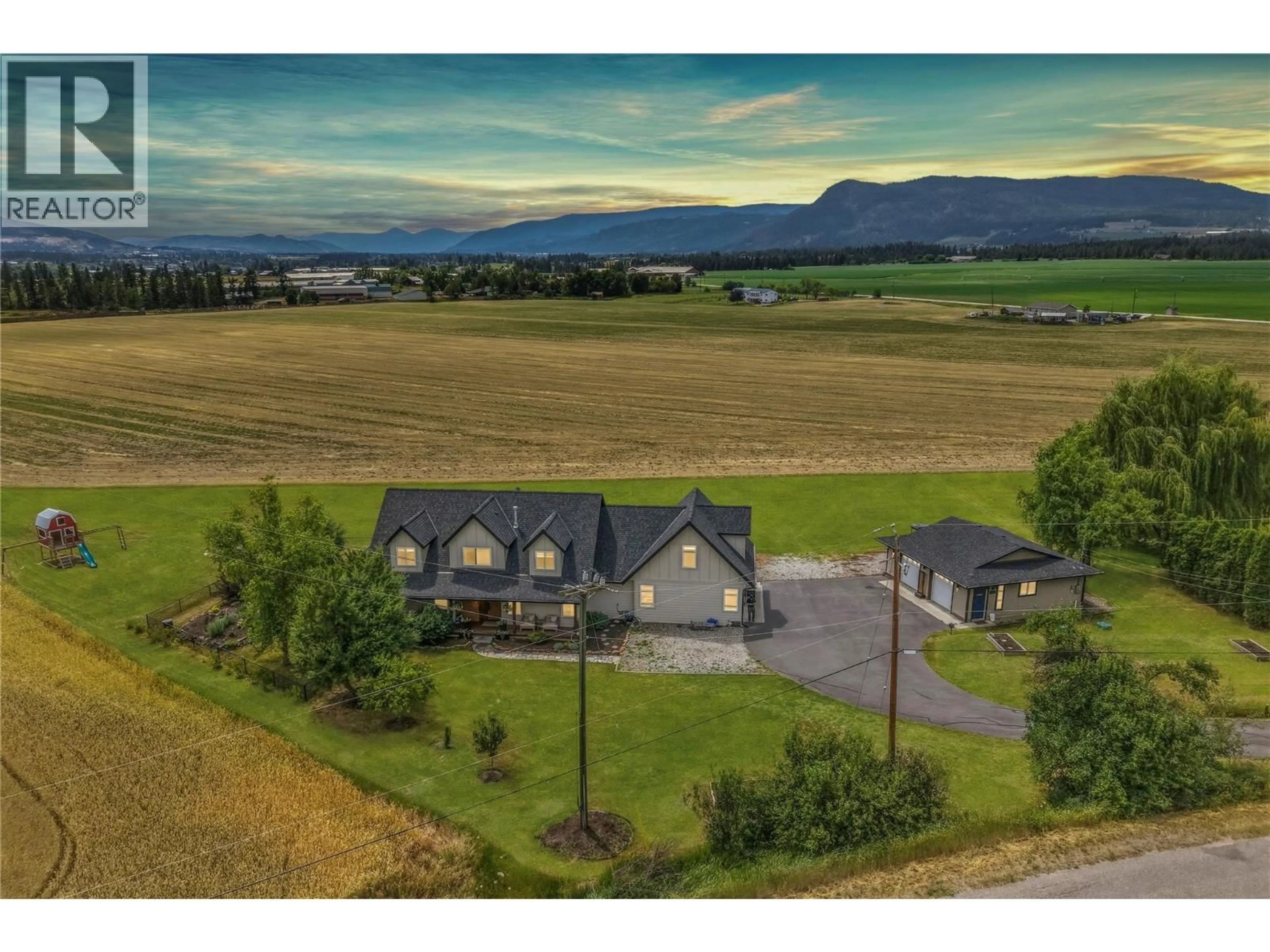 A pic from outside/outdoor area/front of a property/back of a property/a pic from drone, mountain view for 4525 MCLEERY ROAD, Spallumcheen British Columbia V4Y0Y4