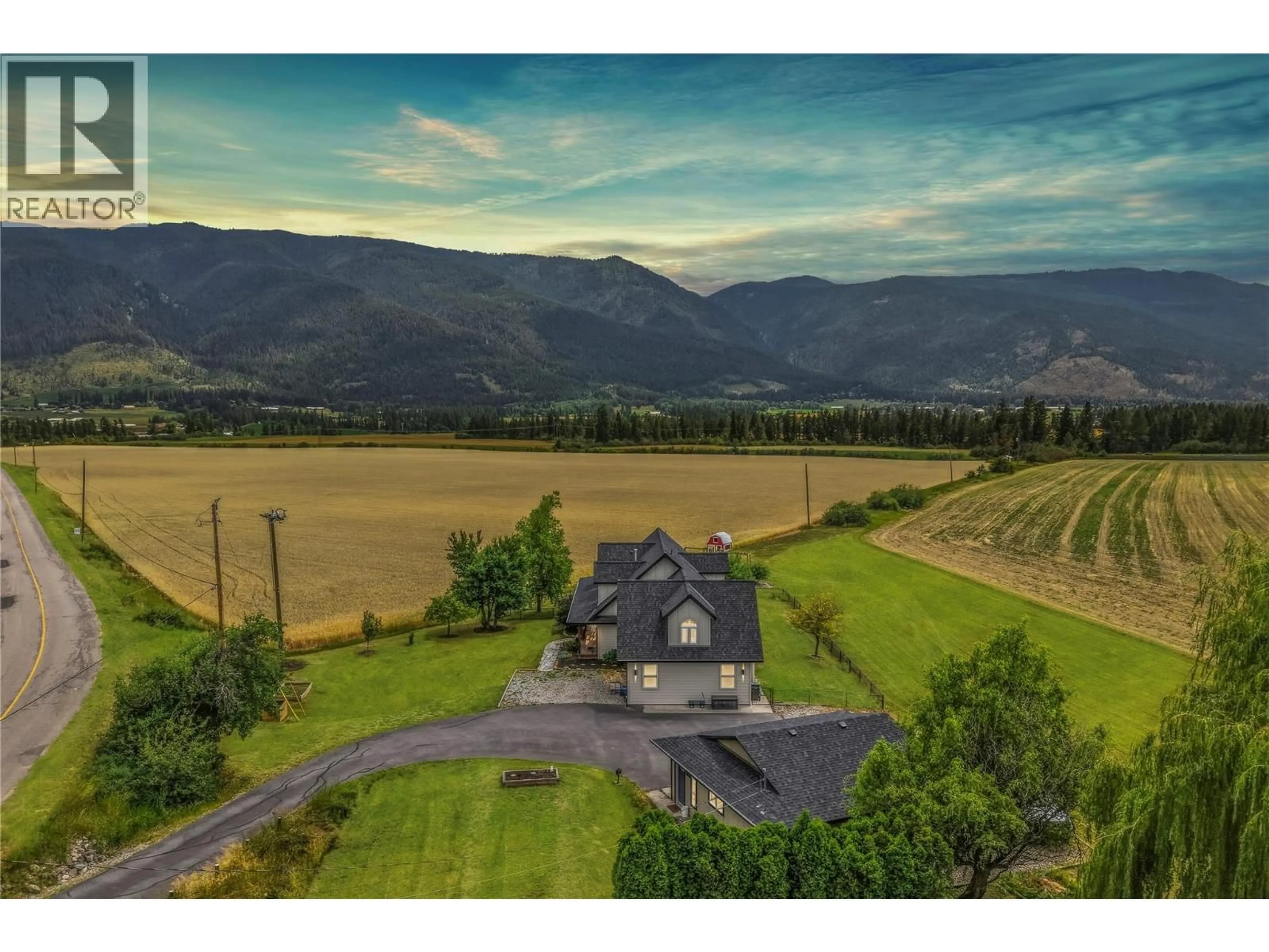 A pic from outside/outdoor area/front of a property/back of a property/a pic from drone, mountain view for 4525 MCLEERY ROAD, Spallumcheen British Columbia V4Y0Y4