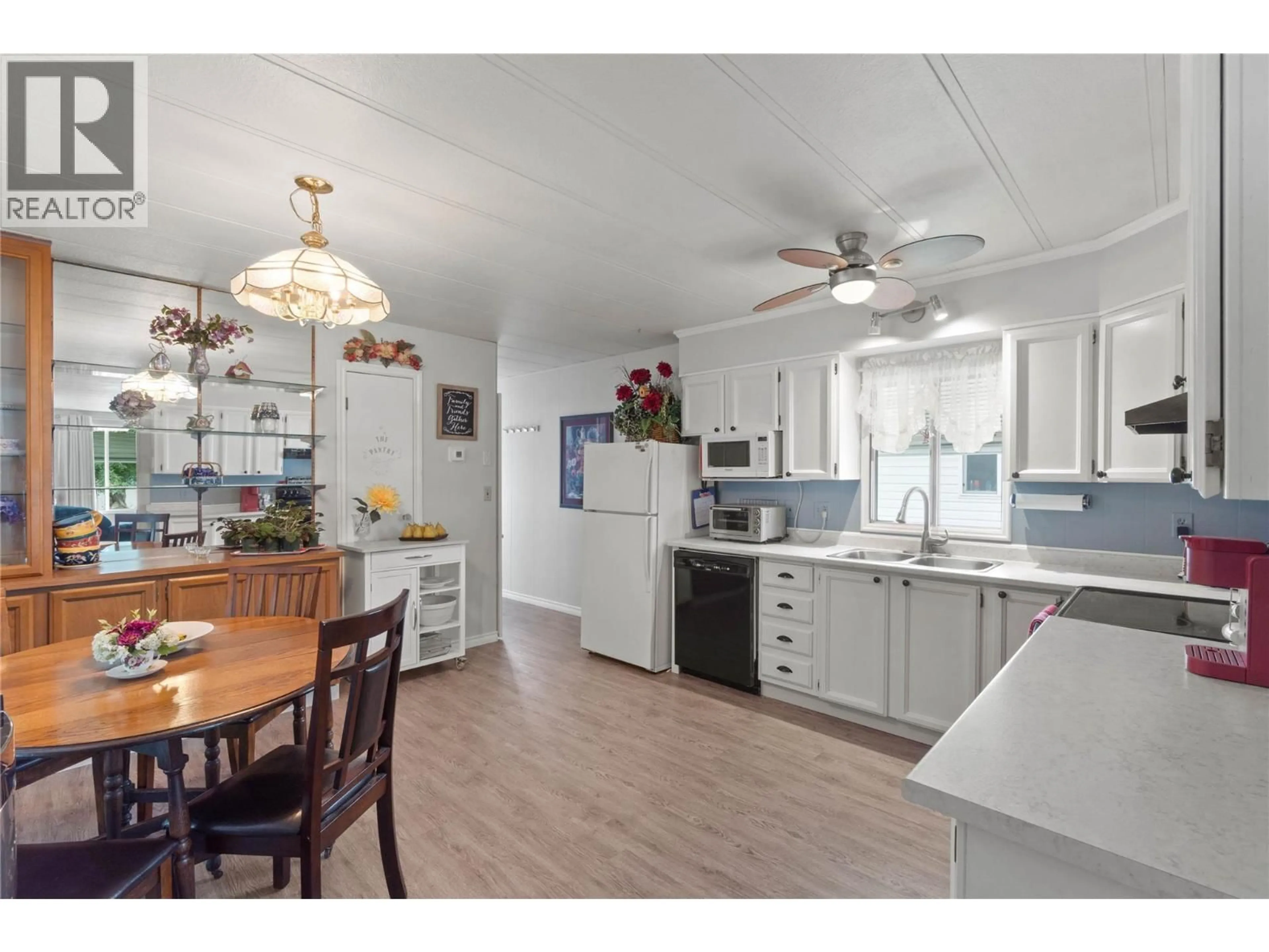 Open concept kitchen, wood/laminate floor for 220 - 2400 OAKDALE WAY, Kamloops British Columbia V2B6W7