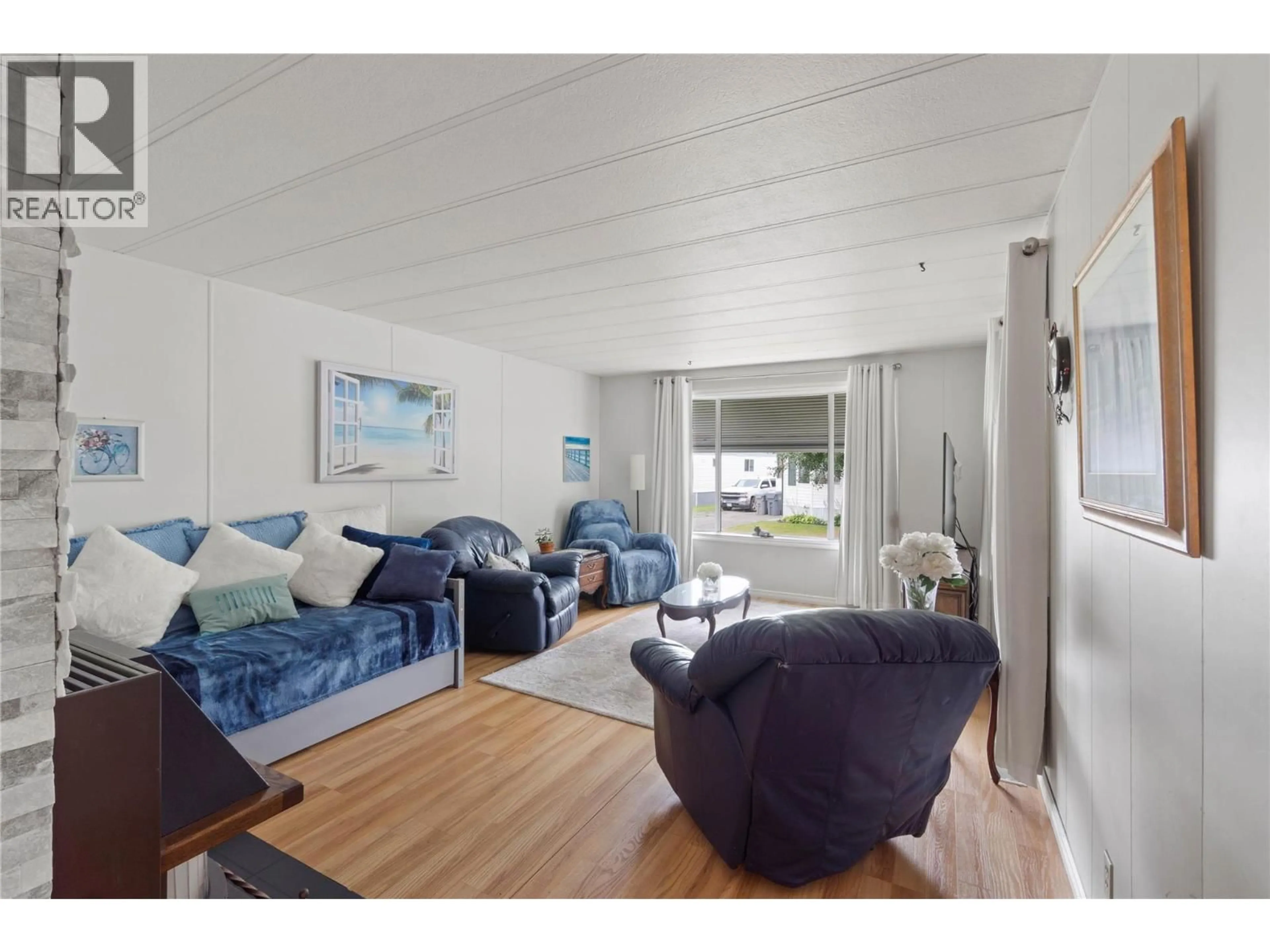 Living room with furniture, wood/laminate floor for 220 - 2400 OAKDALE WAY, Kamloops British Columbia V2B6W7