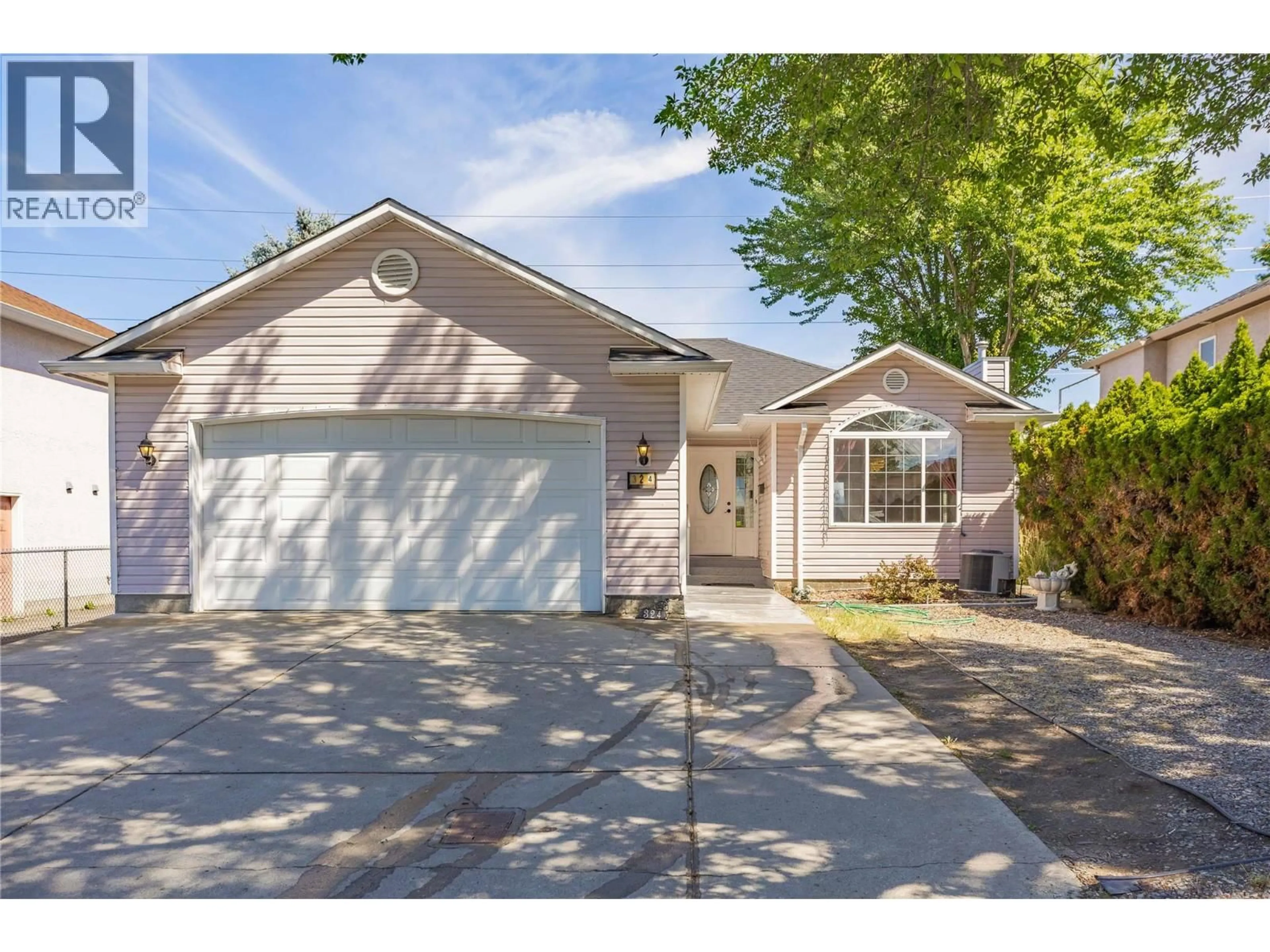 Home with vinyl exterior material, street for 324 KLASSEN ROAD, Kelowna British Columbia V1X7P2