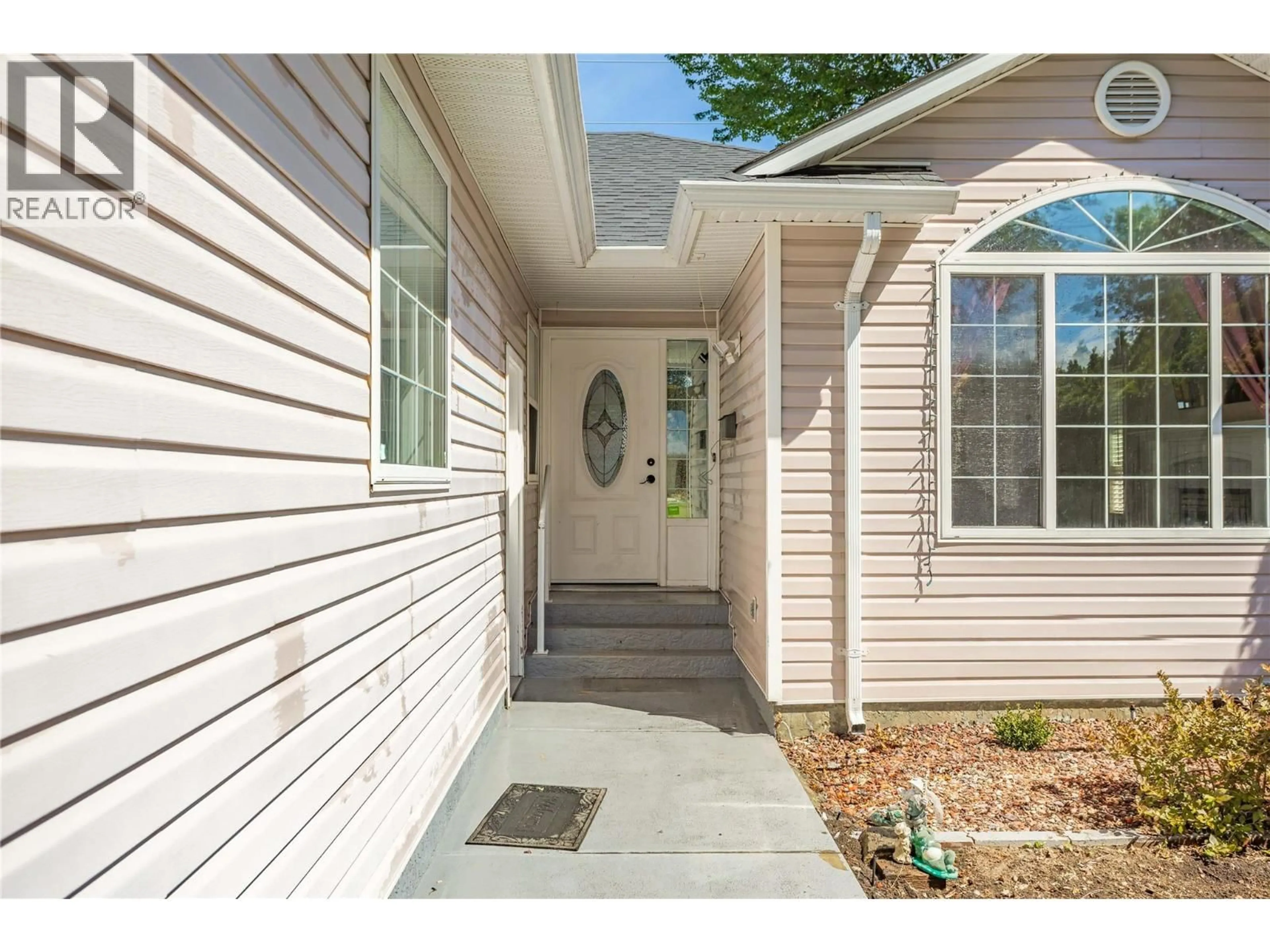 Home with vinyl exterior material, street for 324 KLASSEN ROAD, Kelowna British Columbia V1X7P2