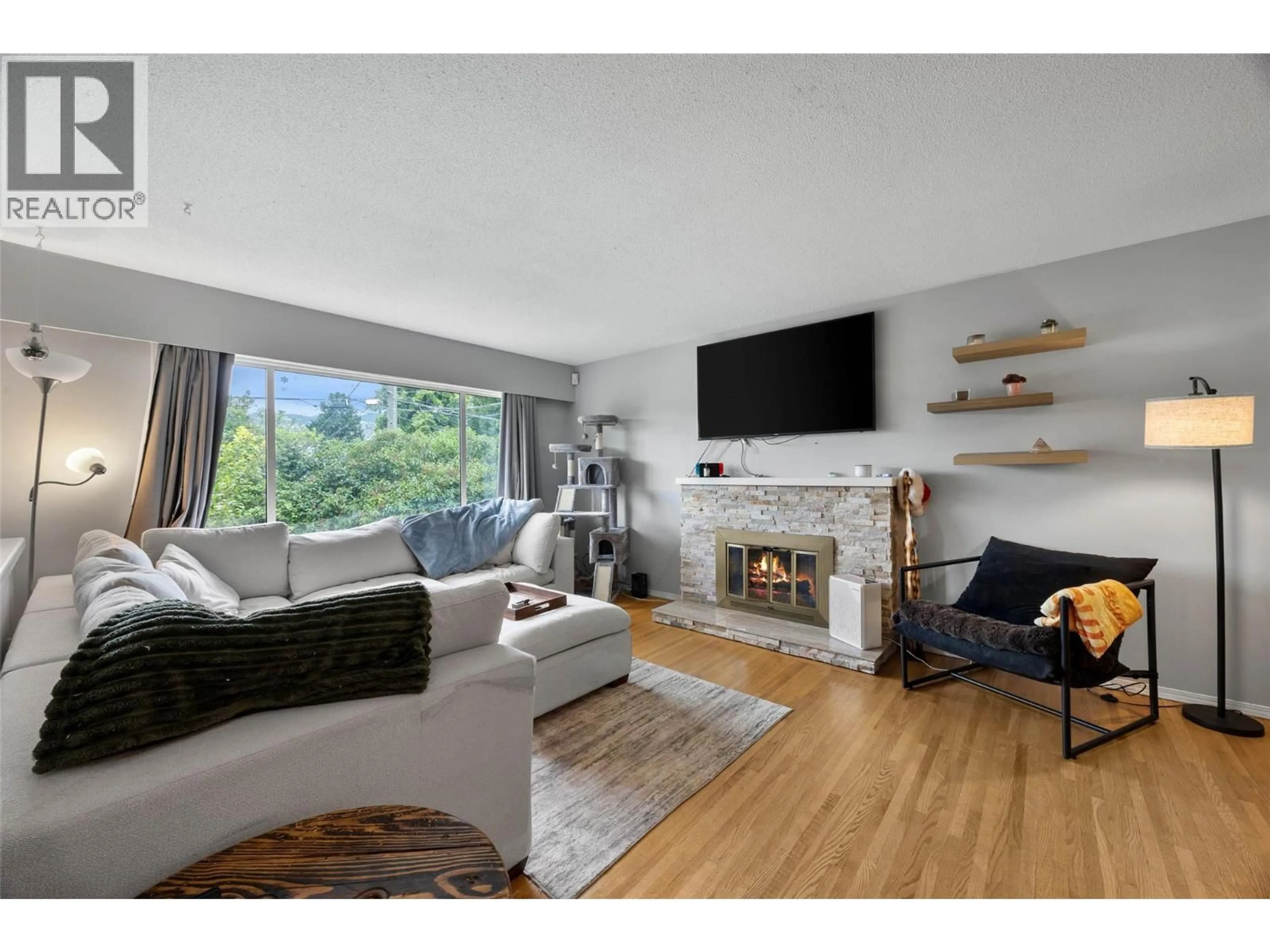 Living room with furniture, wood/laminate floor for 740 SHERWOOD DRIVE, Kamloops British Columbia V2B4E5