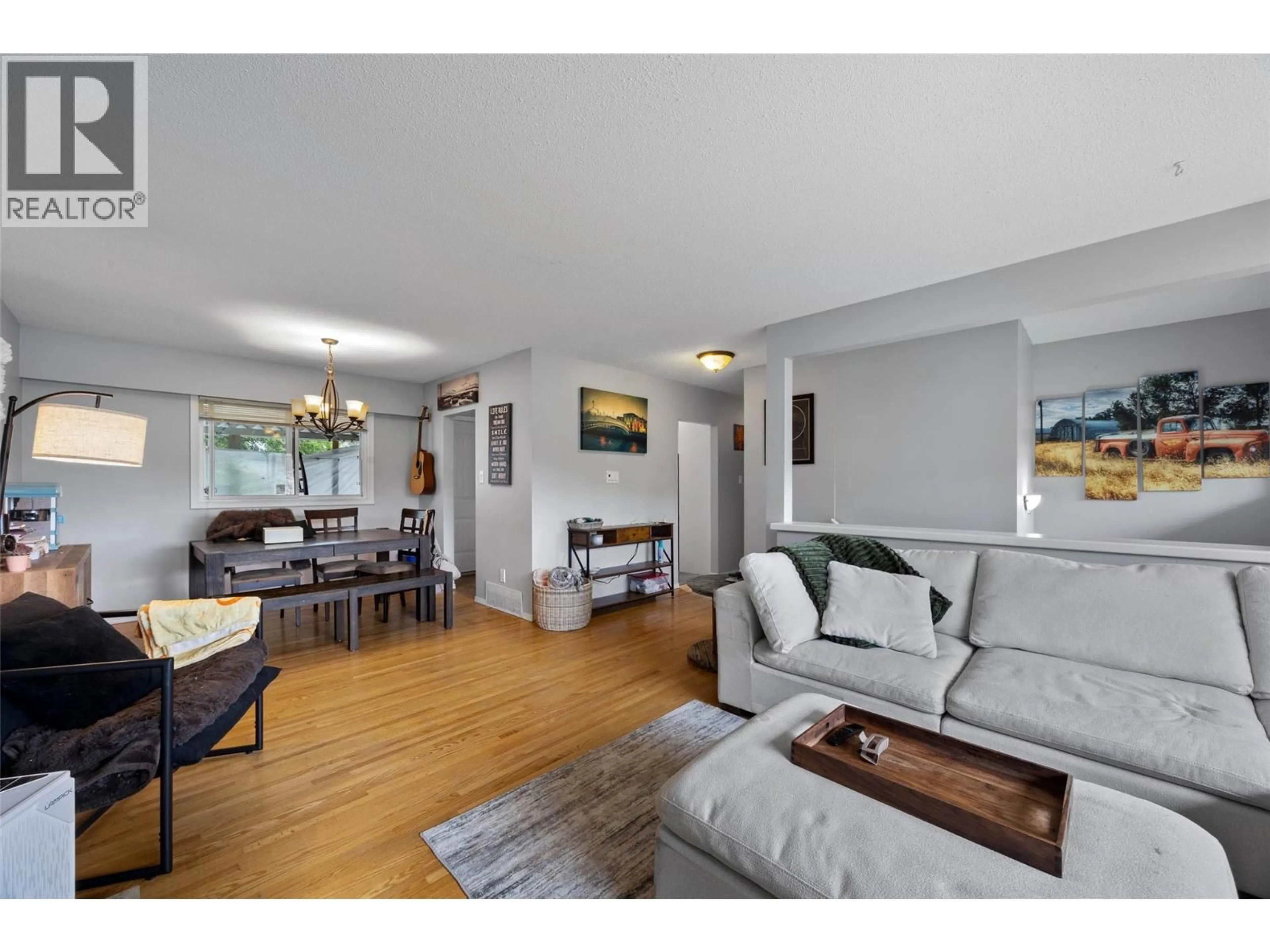 Living room with furniture, wood/laminate floor for 740 SHERWOOD DRIVE, Kamloops British Columbia V2B4E5