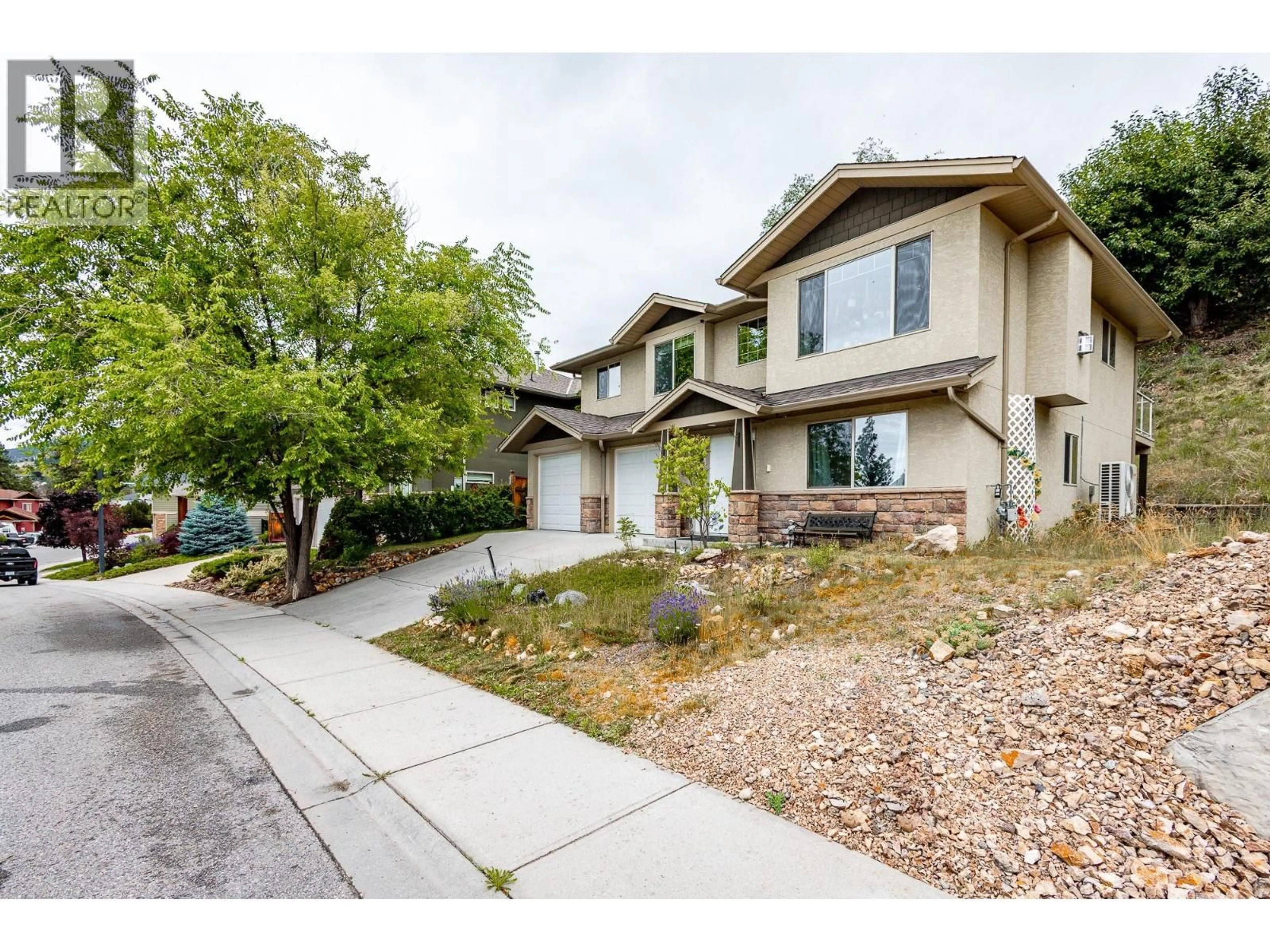 Home with vinyl exterior material, street for 1469 KLOPPENBURG ROAD, Kelowna British Columbia V1P1N6