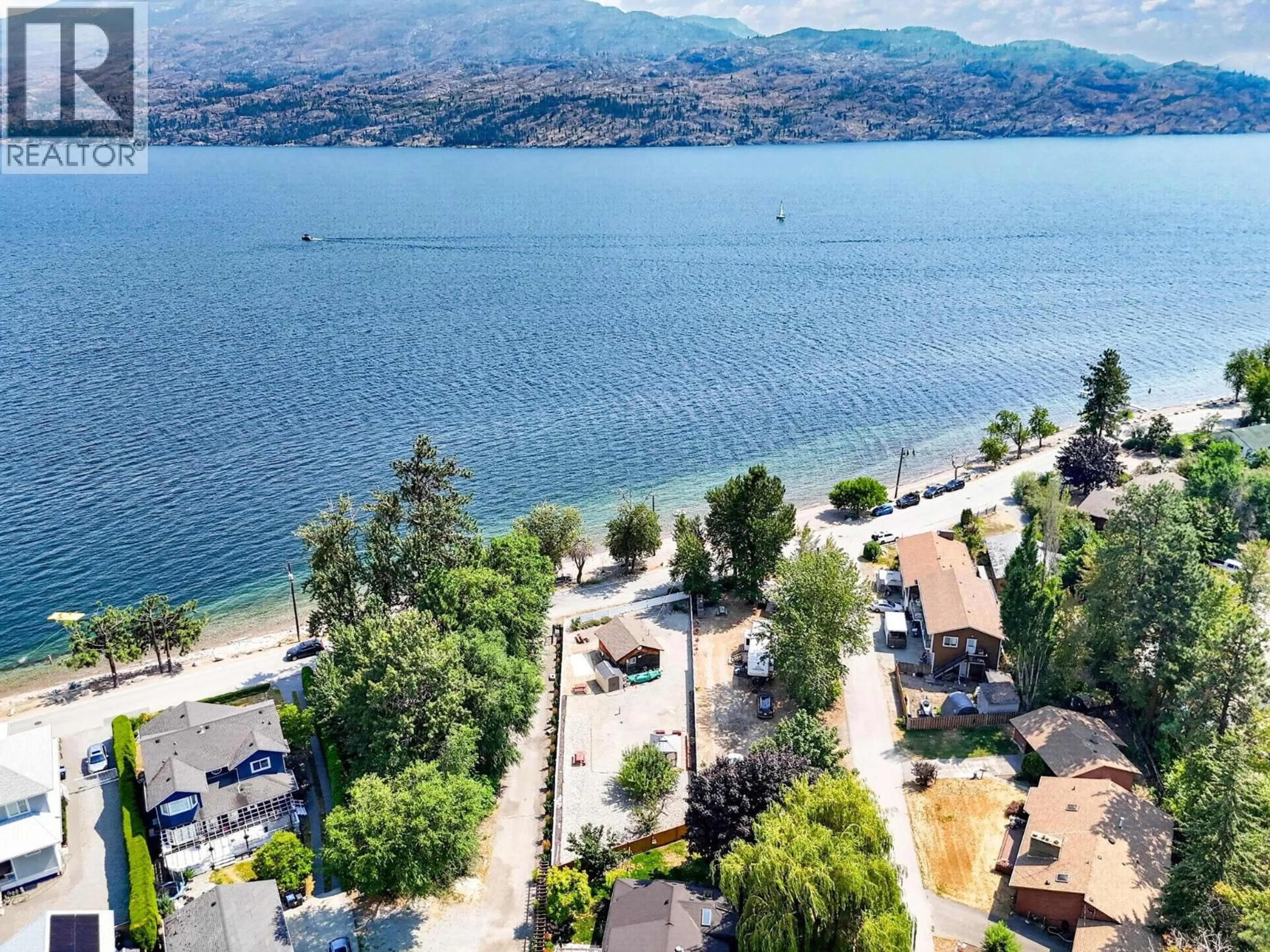 A pic from outside/outdoor area/front of a property/back of a property/a pic from drone, water/lake/river/ocean view for 3922 BEACH AVENUE, Peachland British Columbia V0H1X6