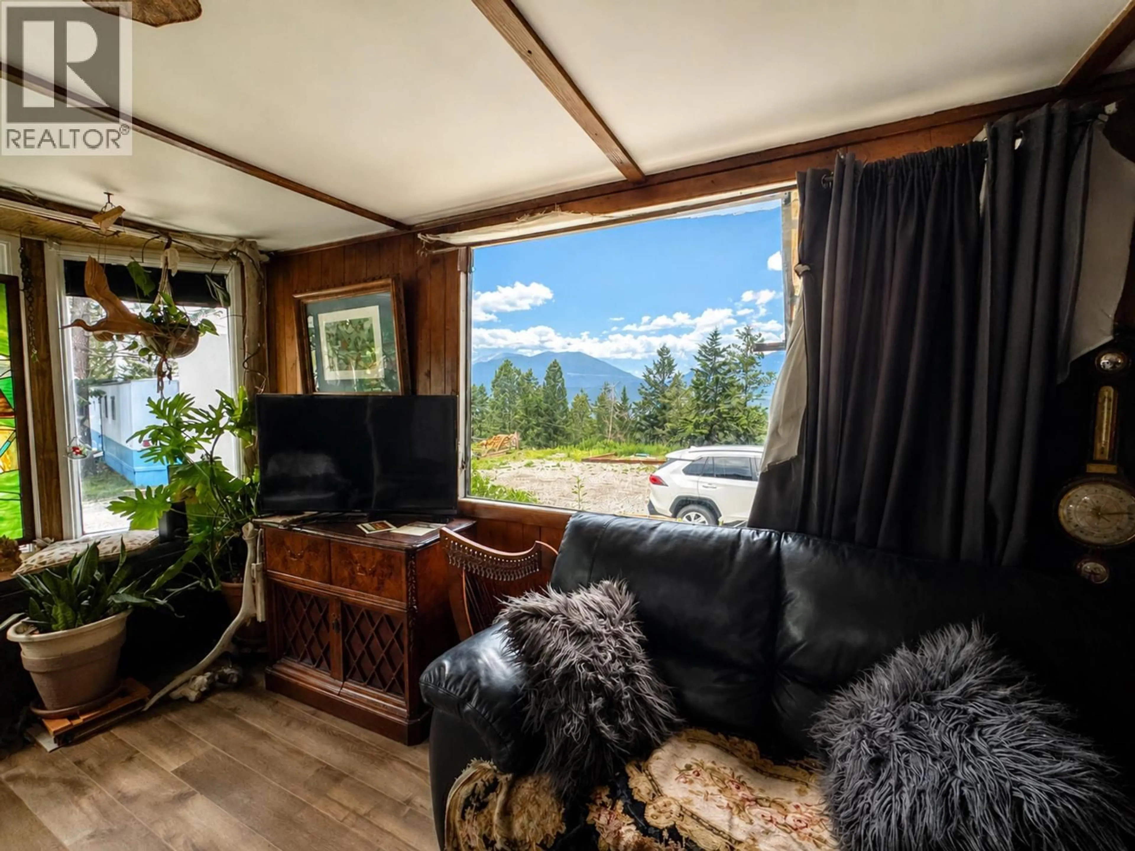Living room with furniture, wood/laminate floor for 28 - 8634 93/95 HIGHWAY, Radium Hot Springs British Columbia V0A1M0