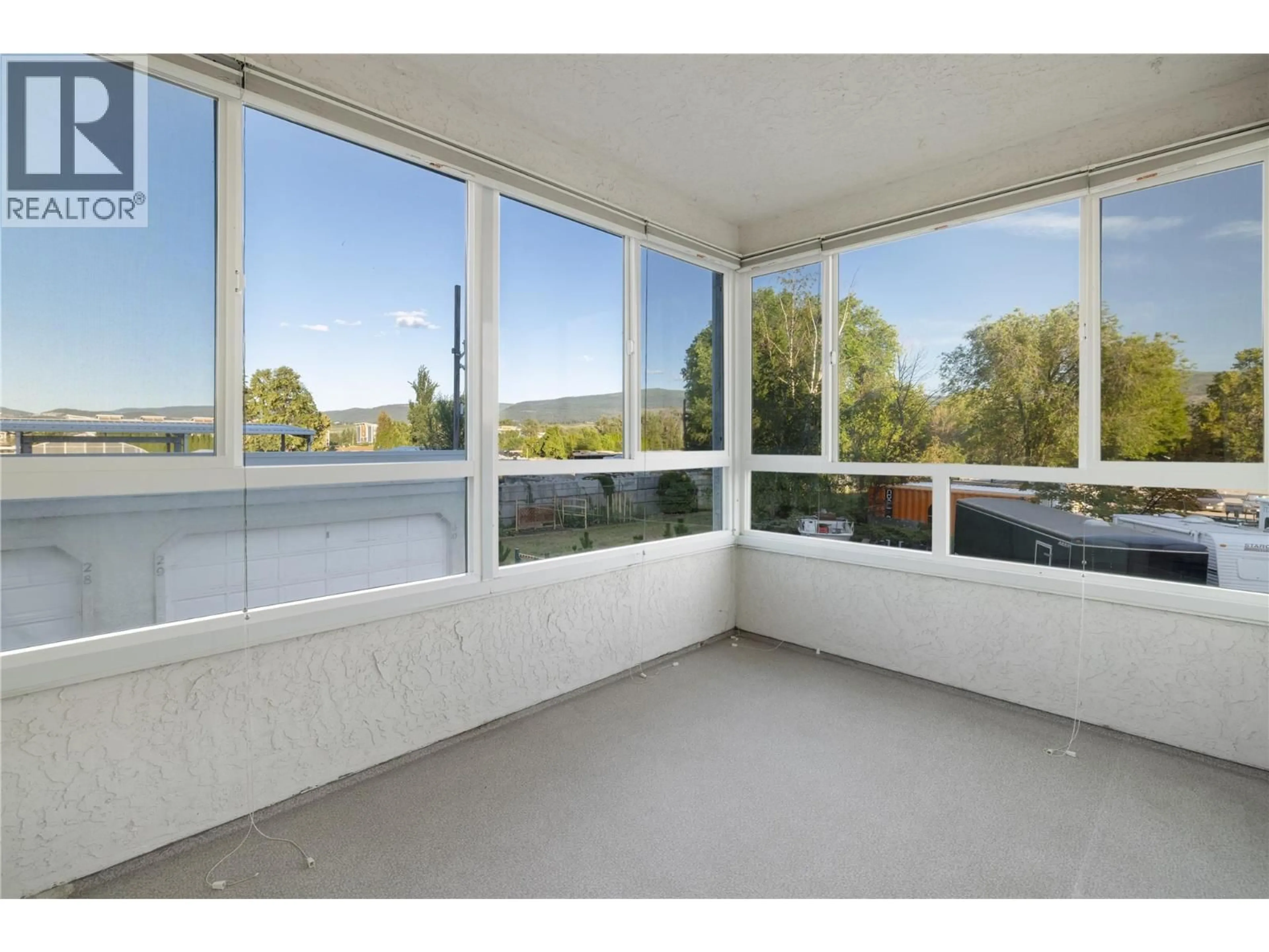 Balcony in the apartment, water/lake/river/ocean view for 210 - 1329 KLO ROAD, Kelowna British Columbia V1W3N9