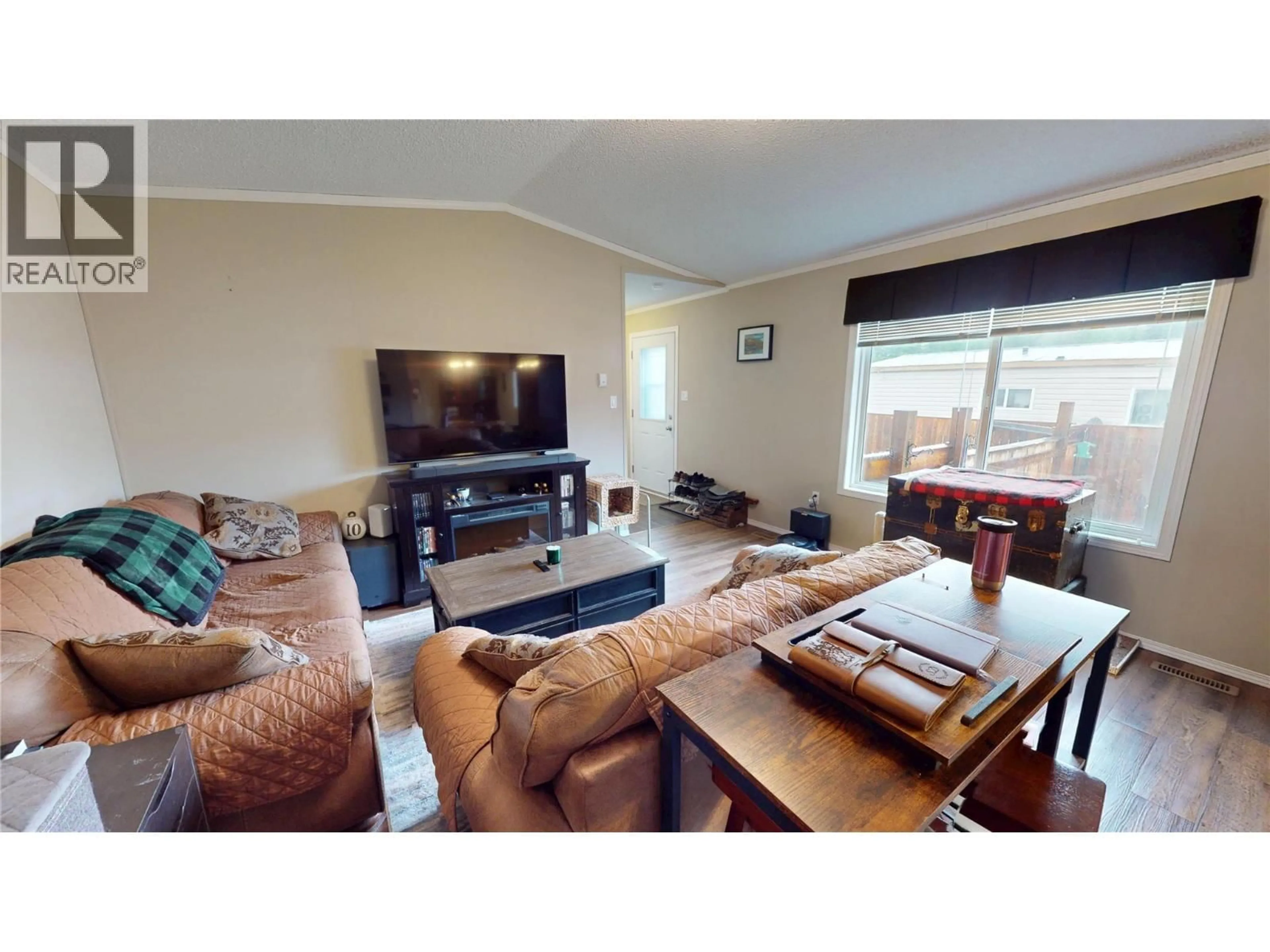 Living room with furniture, wood/laminate floor for 55 - 100 INDUSTRIAL #1 ROAD, Sparwood British Columbia V0B2G1