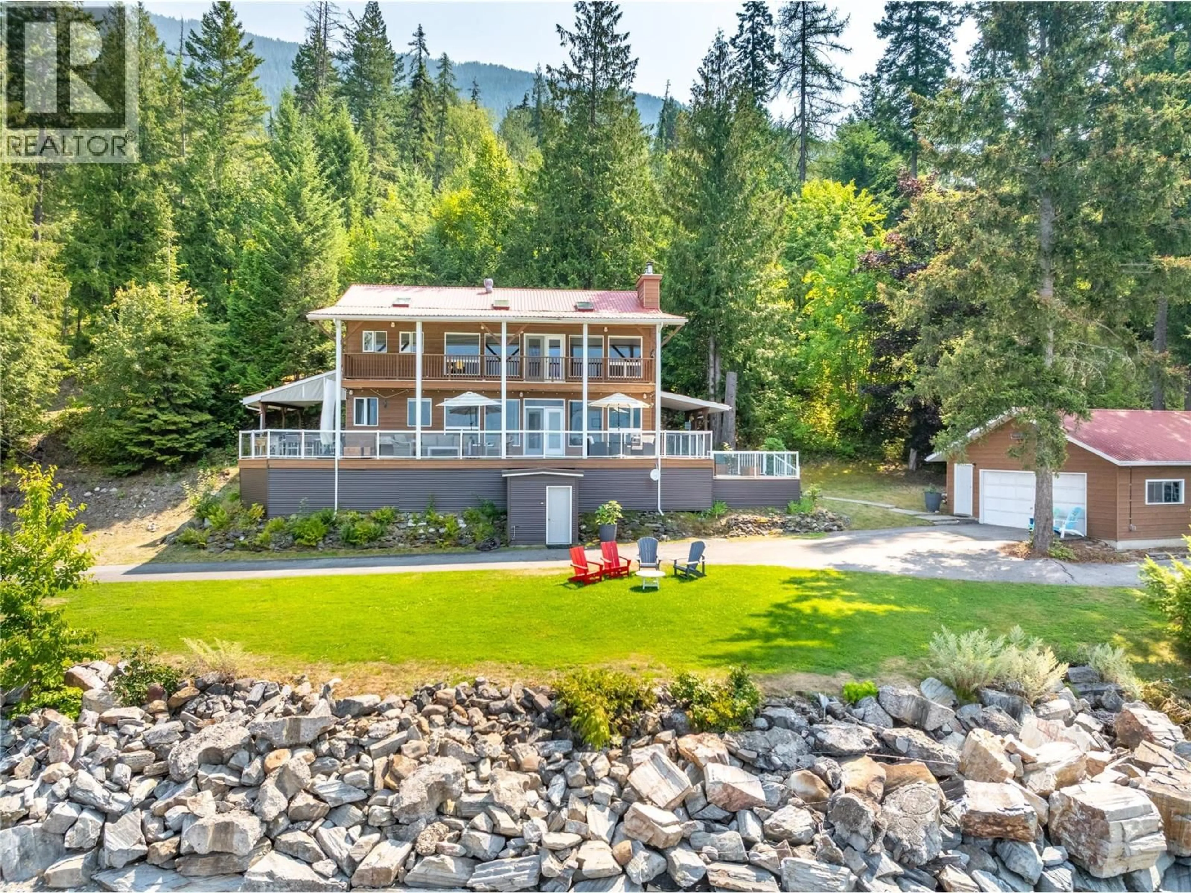 A pic from outside/outdoor area/front of a property/back of a property/a pic from drone, water/lake/river/ocean view for 13883 3A HIGHWAY, Boswell British Columbia V0B1A0