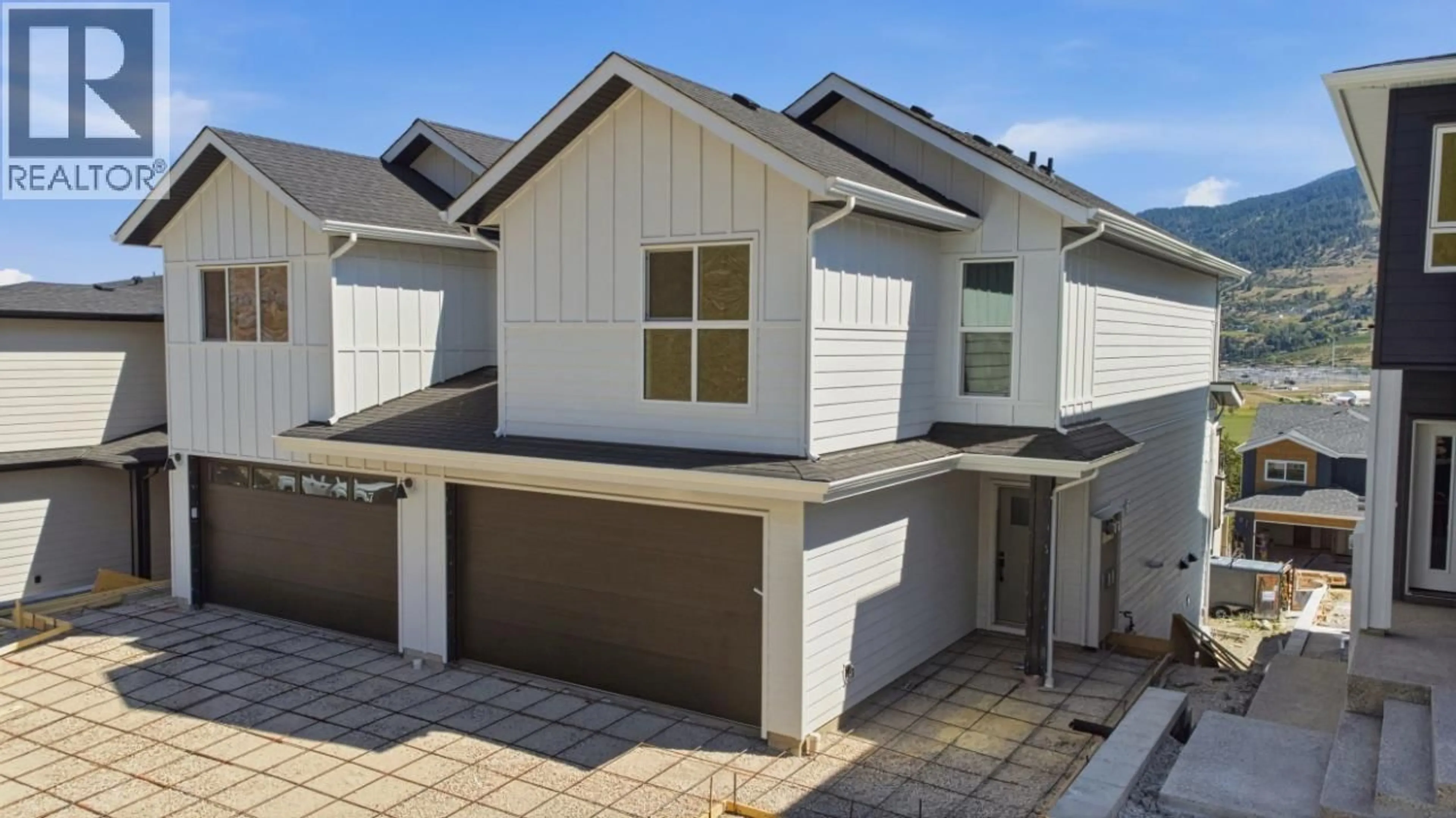 A pic from outside/outdoor area/front of a property/back of a property/a pic from drone, street for 377 ARROWLEAF RISE, Coldstream British Columbia V1B0B5