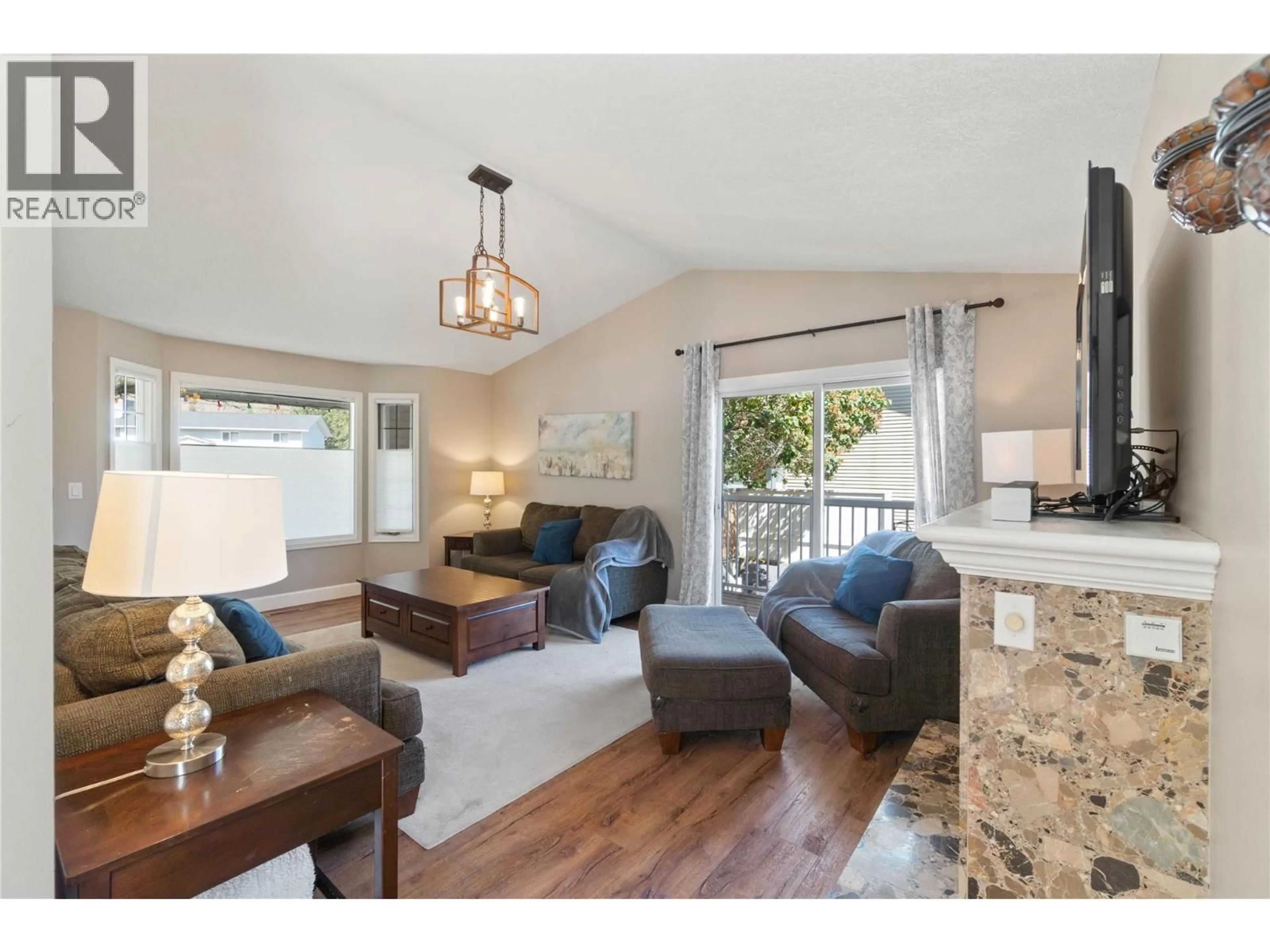 Living room with furniture, wood/laminate floor for 3225 HARGRAVES PLACE, Kamloops British Columbia V2B8H3