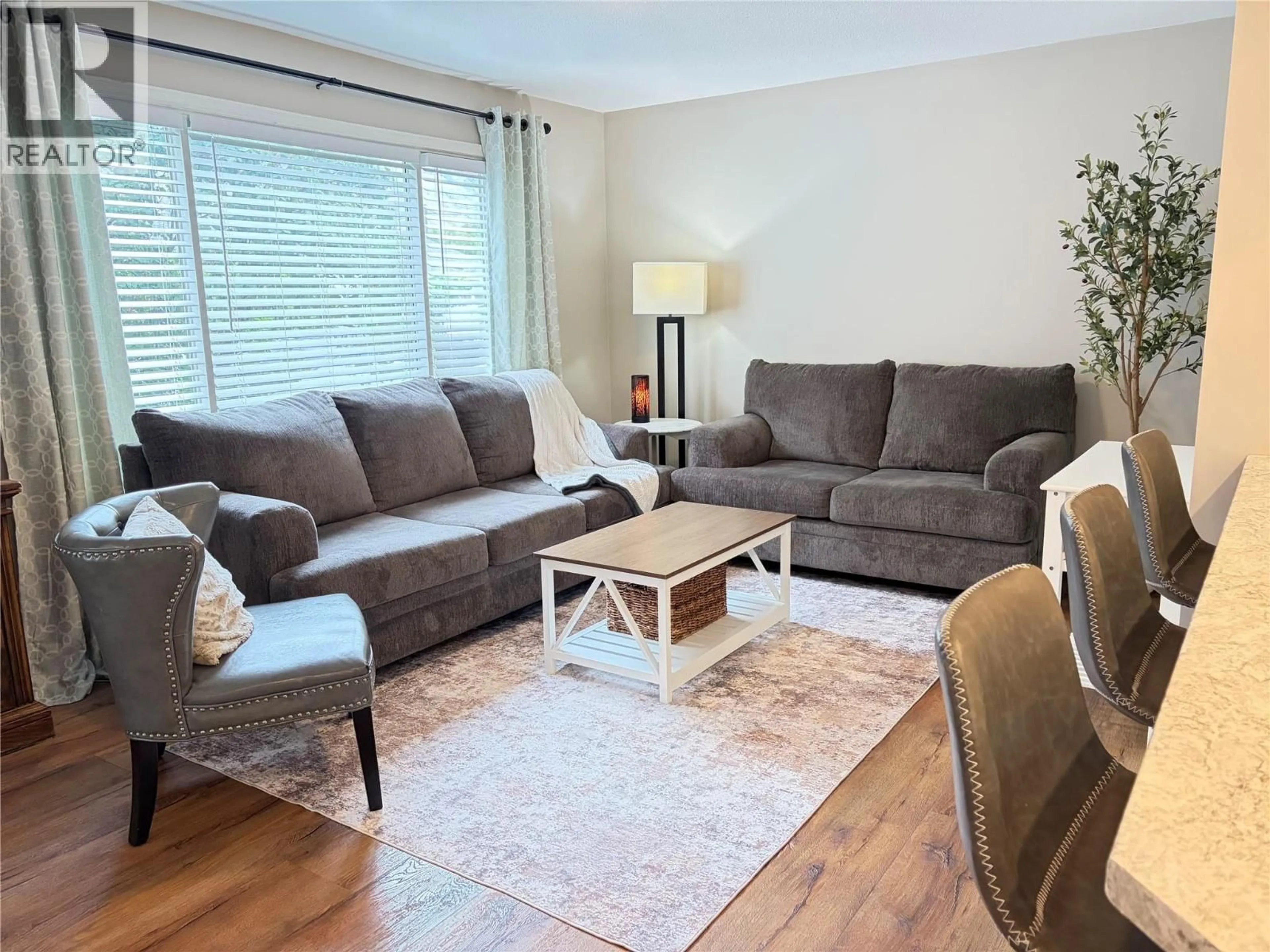 Living room with furniture, wood/laminate floor for 3225 HARGRAVES PLACE, Kamloops British Columbia V2B8H3