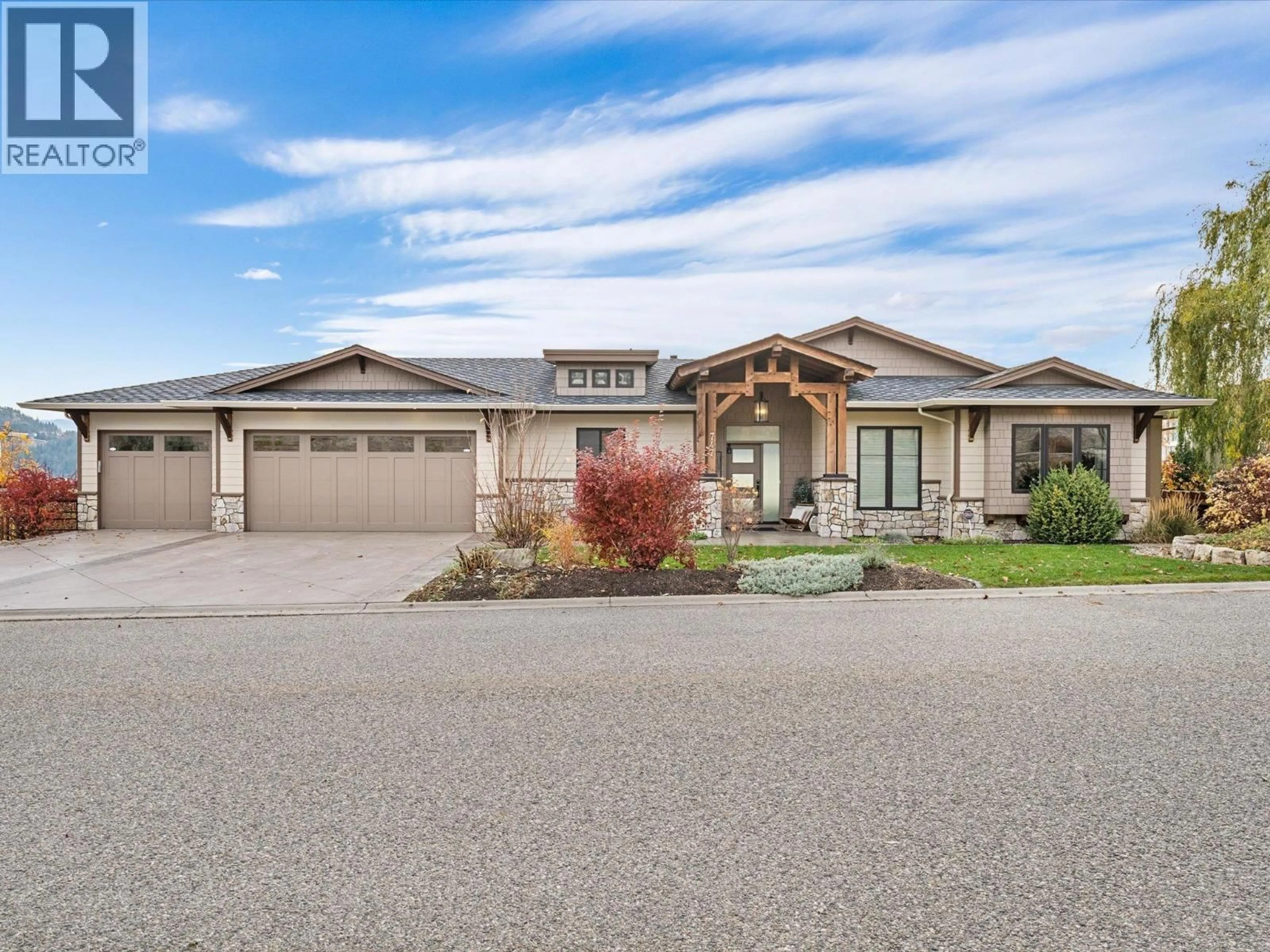 Home with vinyl exterior material, street for 747 TRADITIONS CRESCENT, Kelowna British Columbia V1V2Y2