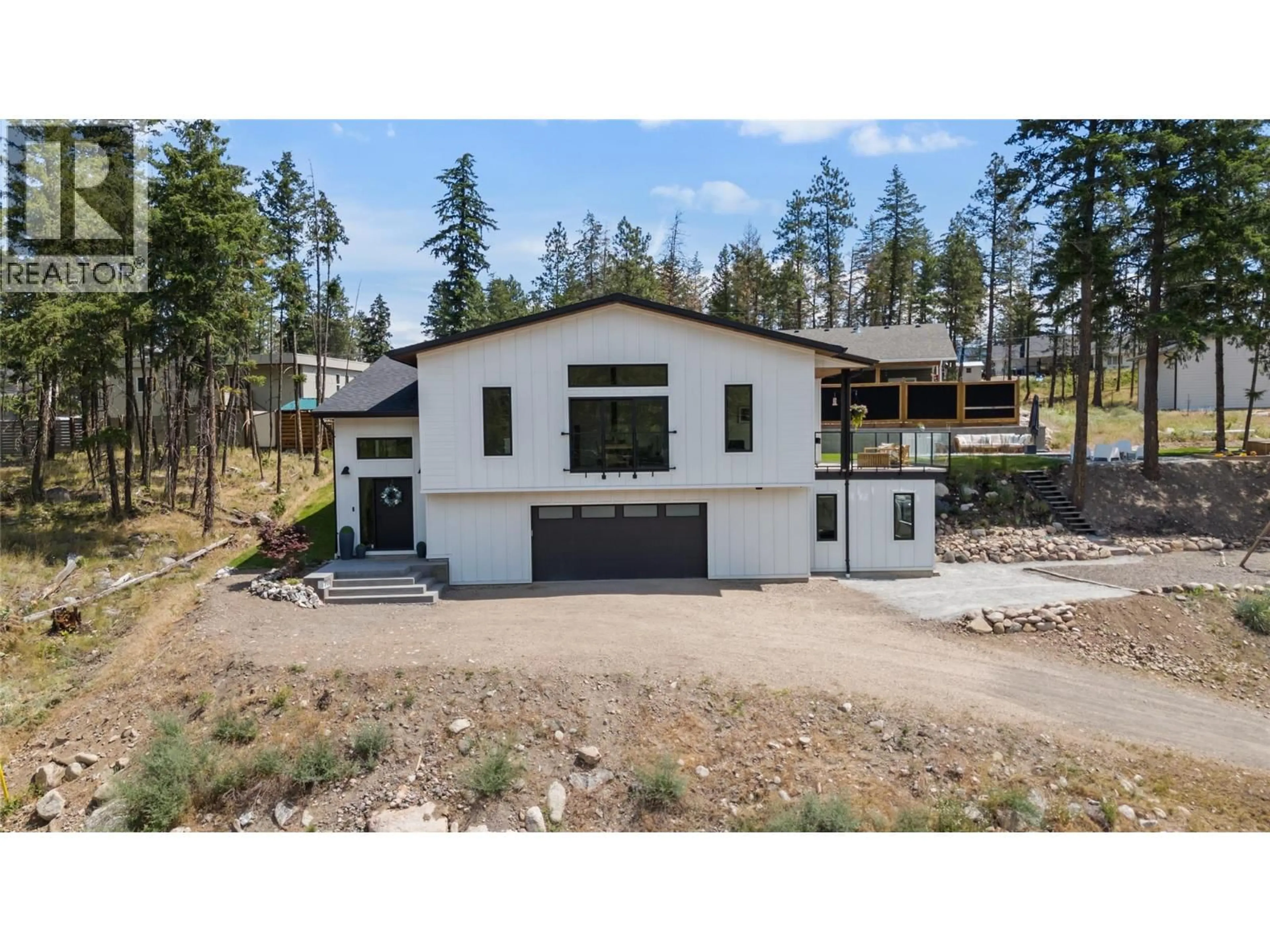 Home with vinyl exterior material, unknown for 7111 DUNWATERS ROAD, Kelowna British Columbia V1W3W6