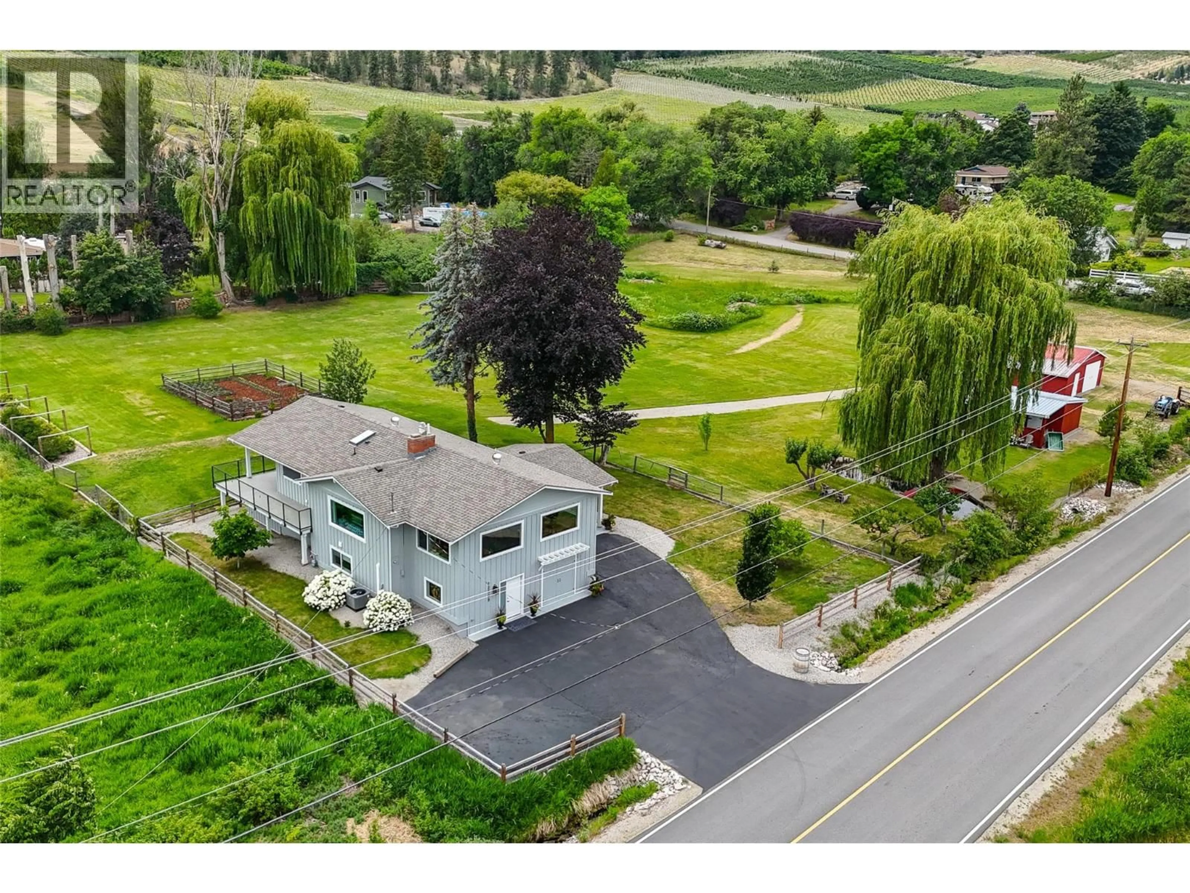A pic from outside/outdoor area/front of a property/back of a property/a pic from drone, street for 12509 DALE MEADOWS ROAD, Summerland British Columbia V0H1Z8