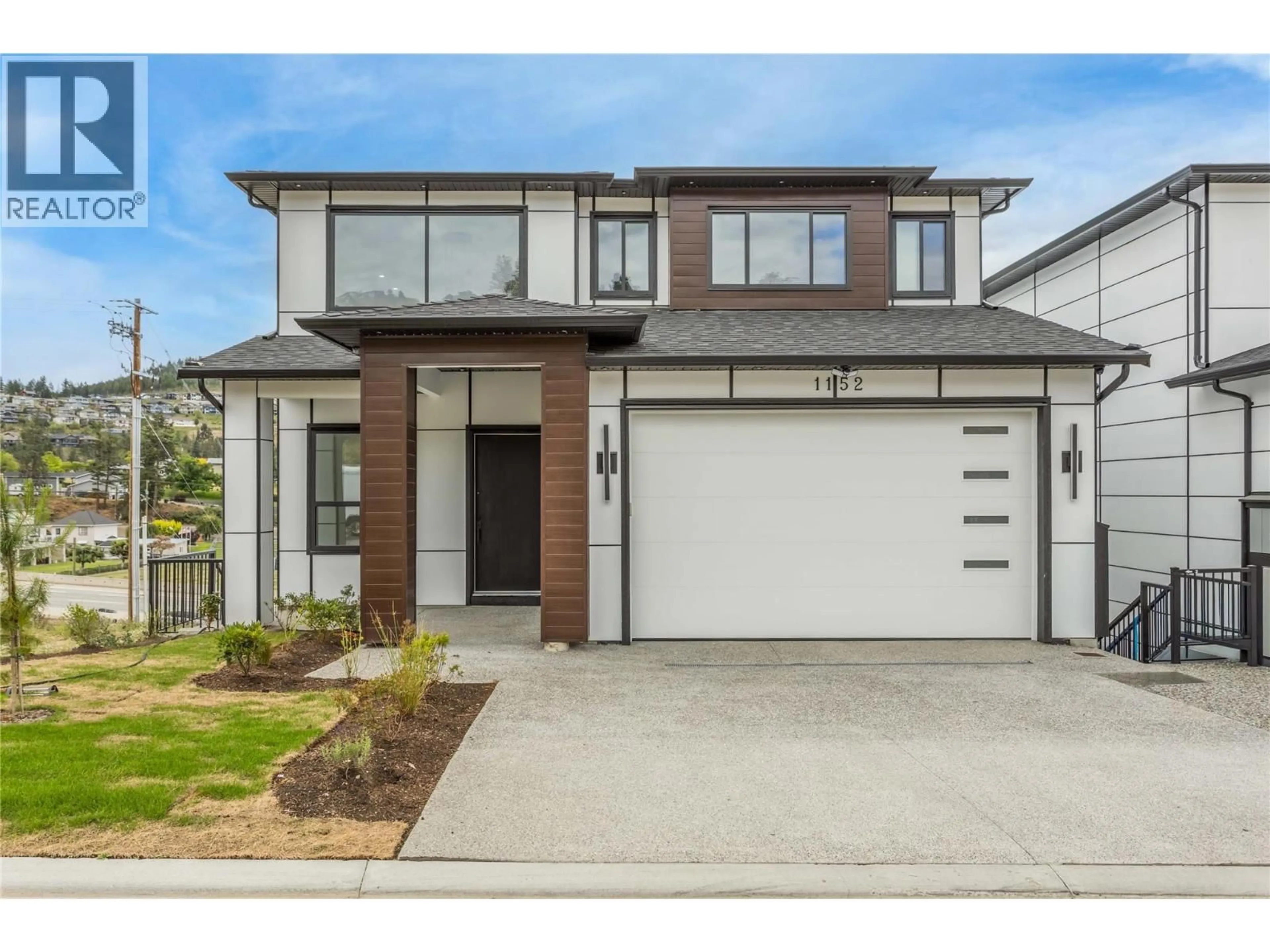 Home with brick exterior material, street for 1152 HUME AVENUE, Kelowna British Columbia V1P0A9