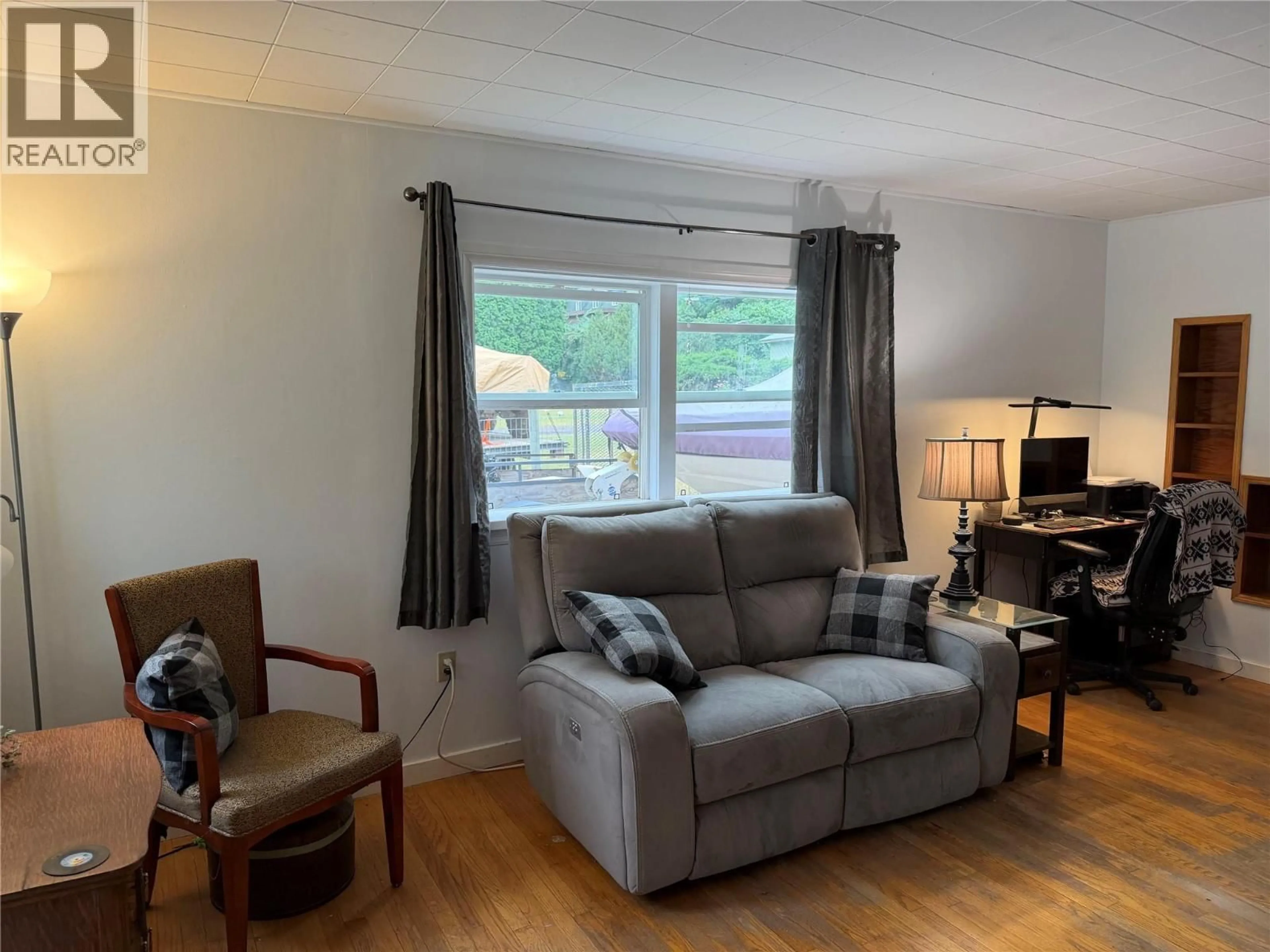 Living room with furniture, wood/laminate floor for 1607 PINEGROVE STREET, Lillooet British Columbia V0K1V0