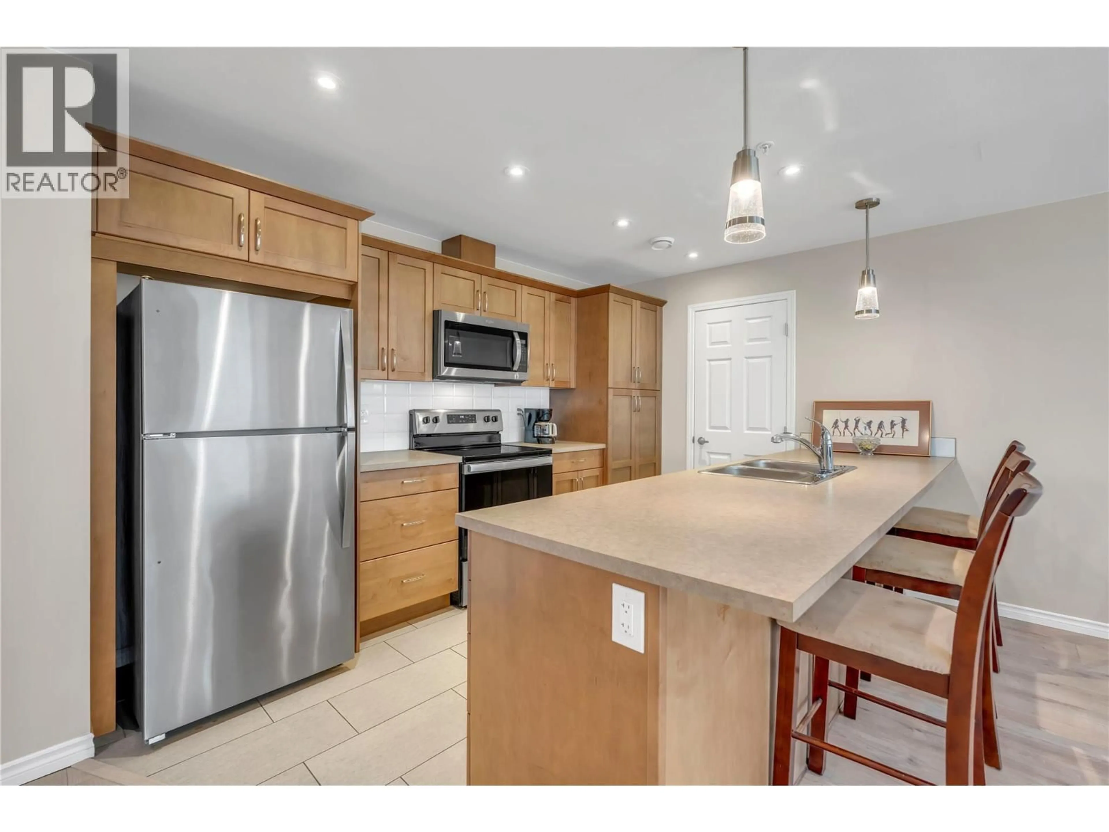 Open concept kitchen, ceramic/tile floor for 804 - 3346 SKAHA LAKE ROAD, Penticton British Columbia V2A6G4