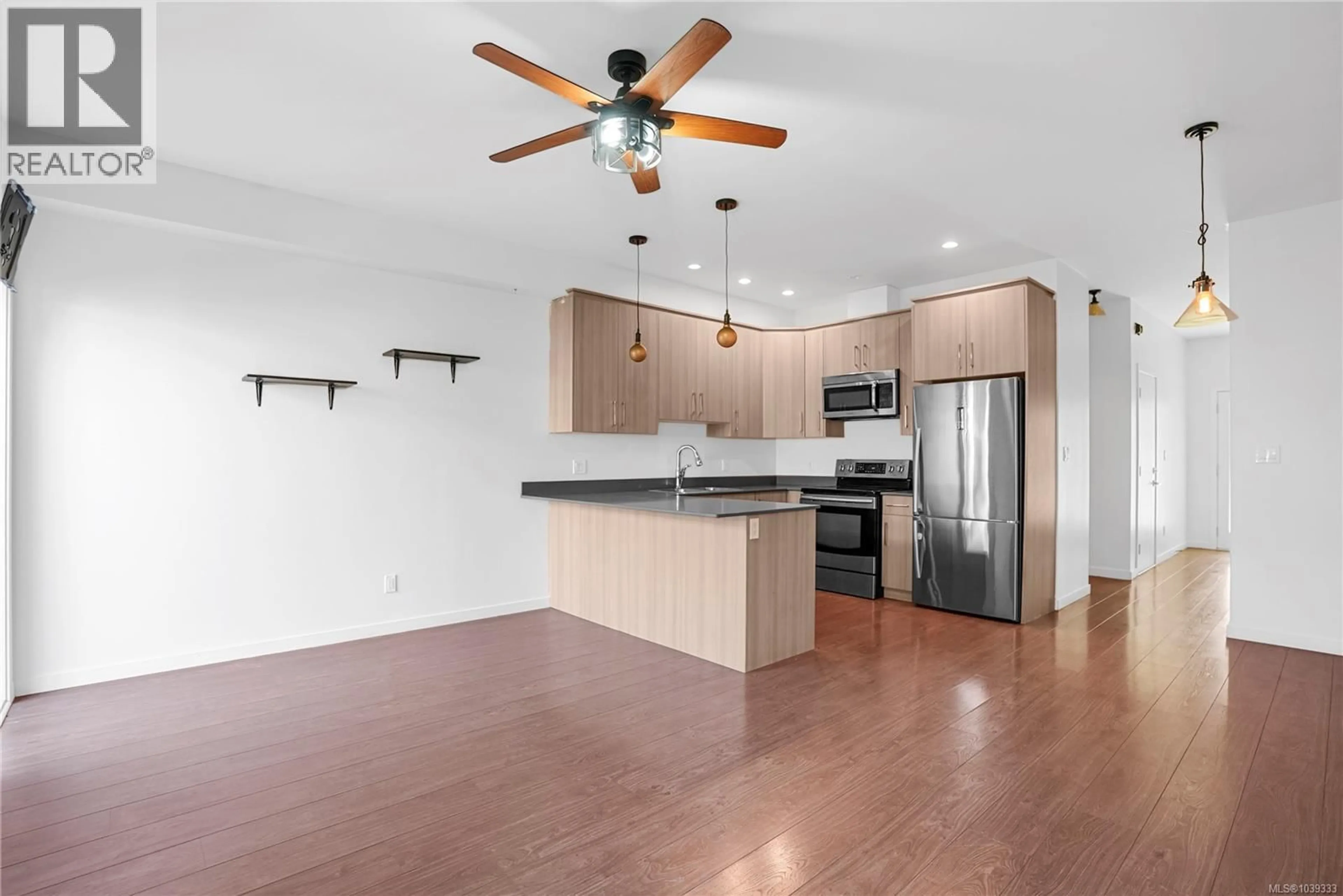 Open concept kitchen, wood/laminate floor for 3396 CROSSBILL TERRACE, Langford British Columbia V9C0J9