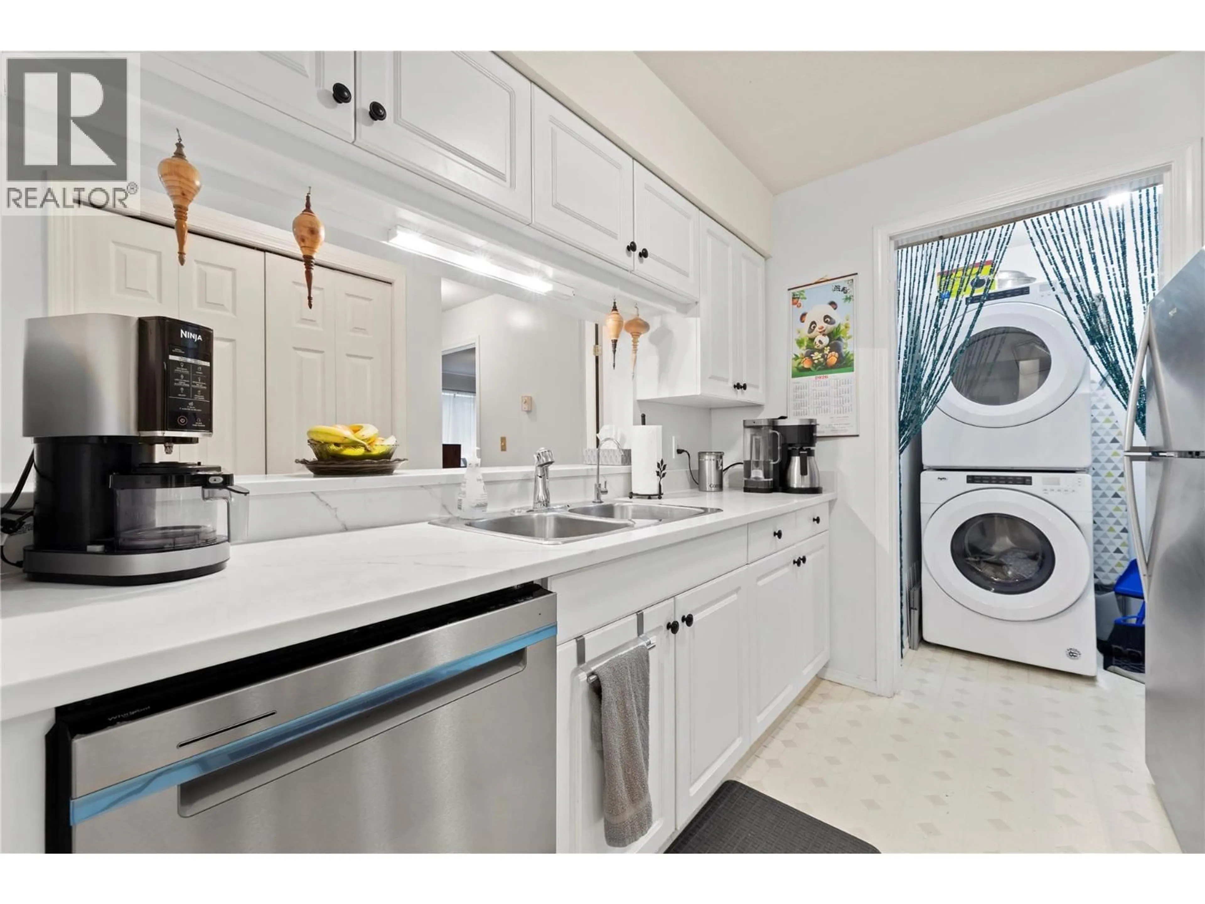 Kitchen with laundary machines, ceramic/tile floor for 211 - 650 3 STREET SOUTHWEST, Salmon Arm British Columbia V1E1P6
