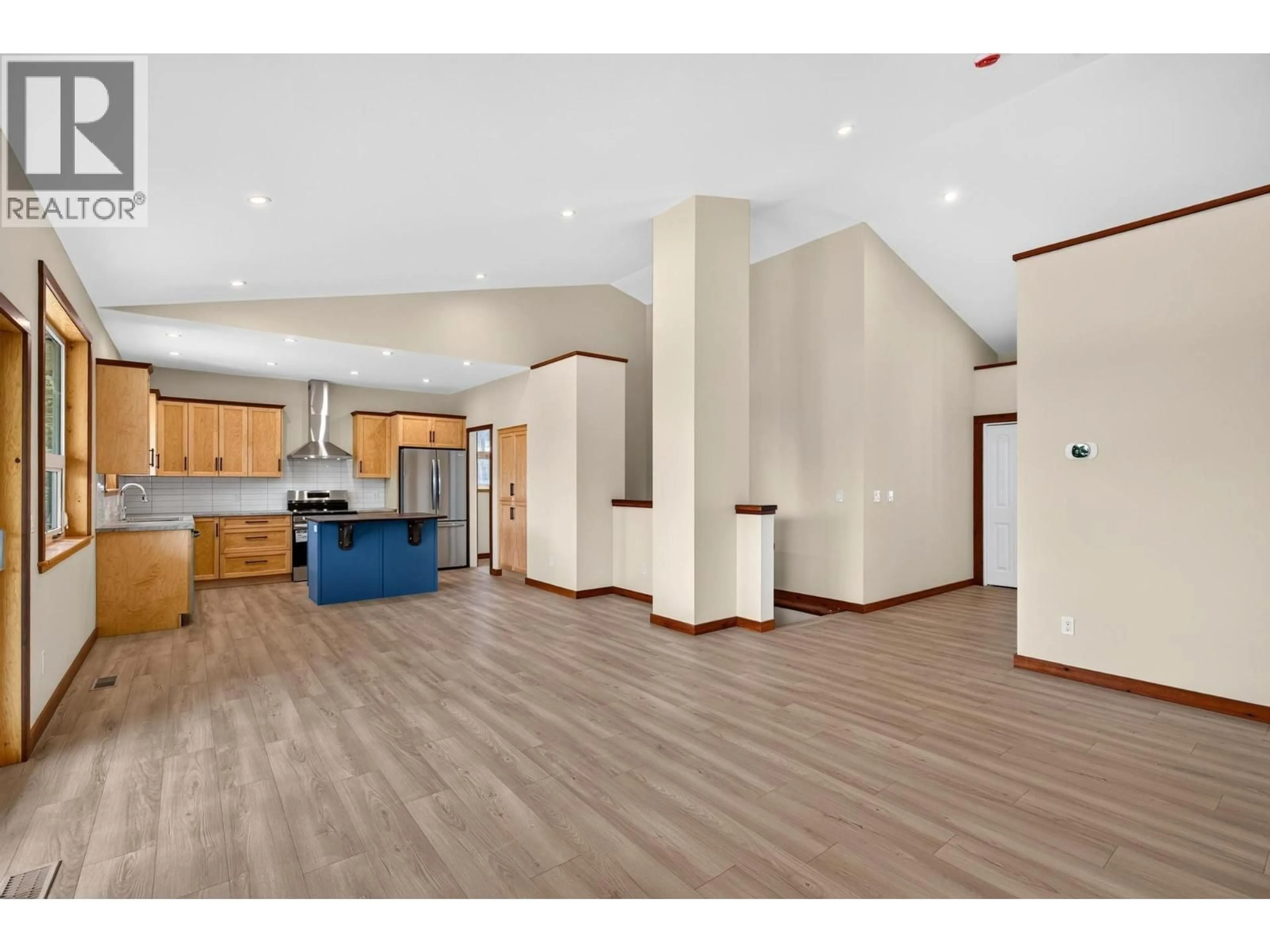 Open concept kitchen, wood/laminate floor for 766 BALSAM ROAD, Kelowna British Columbia V1Z3V8