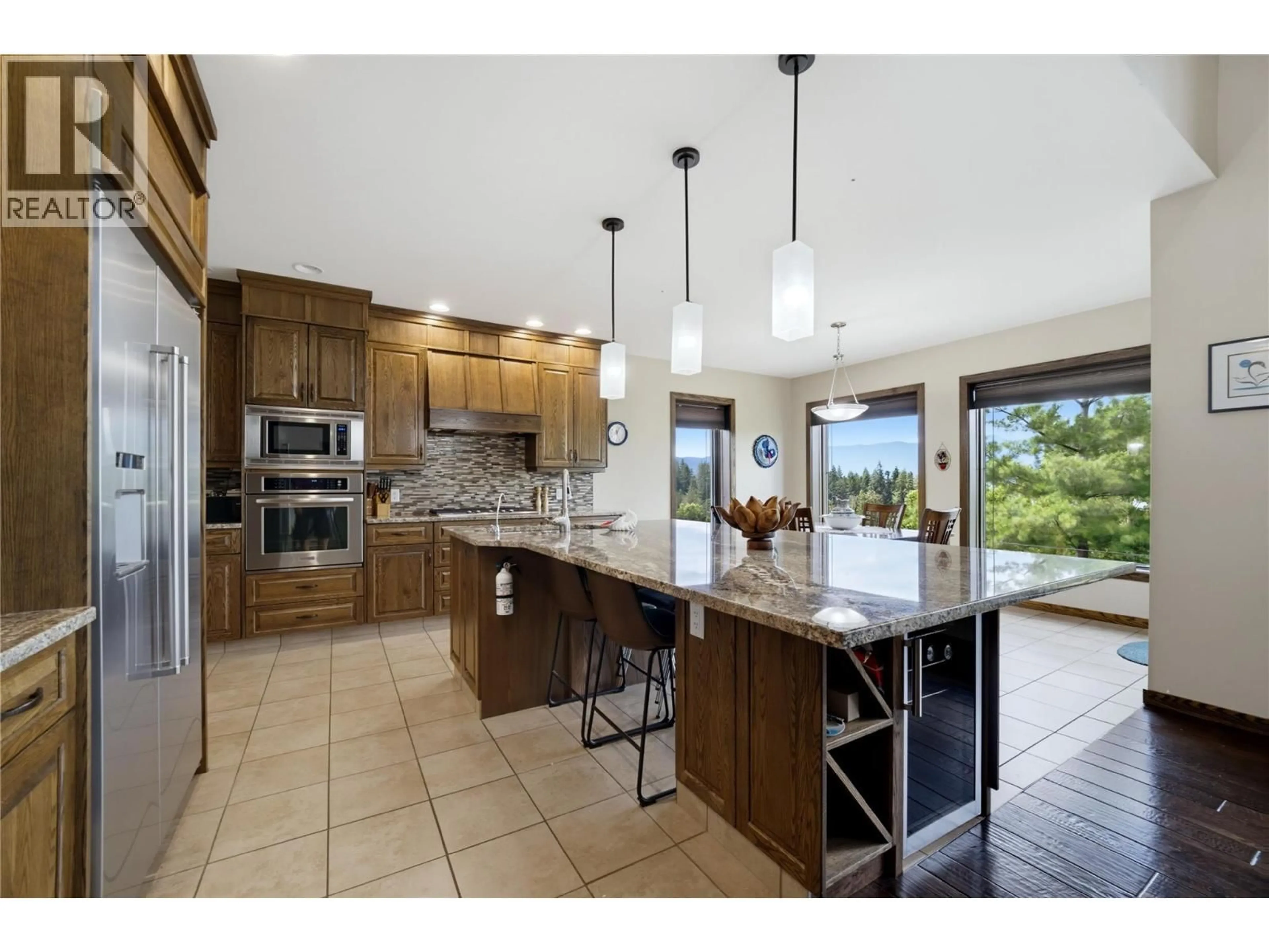 Open concept kitchen, ceramic/tile floor for 2421 25 STREET NORTHEAST, Salmon Arm British Columbia V1E2Z7
