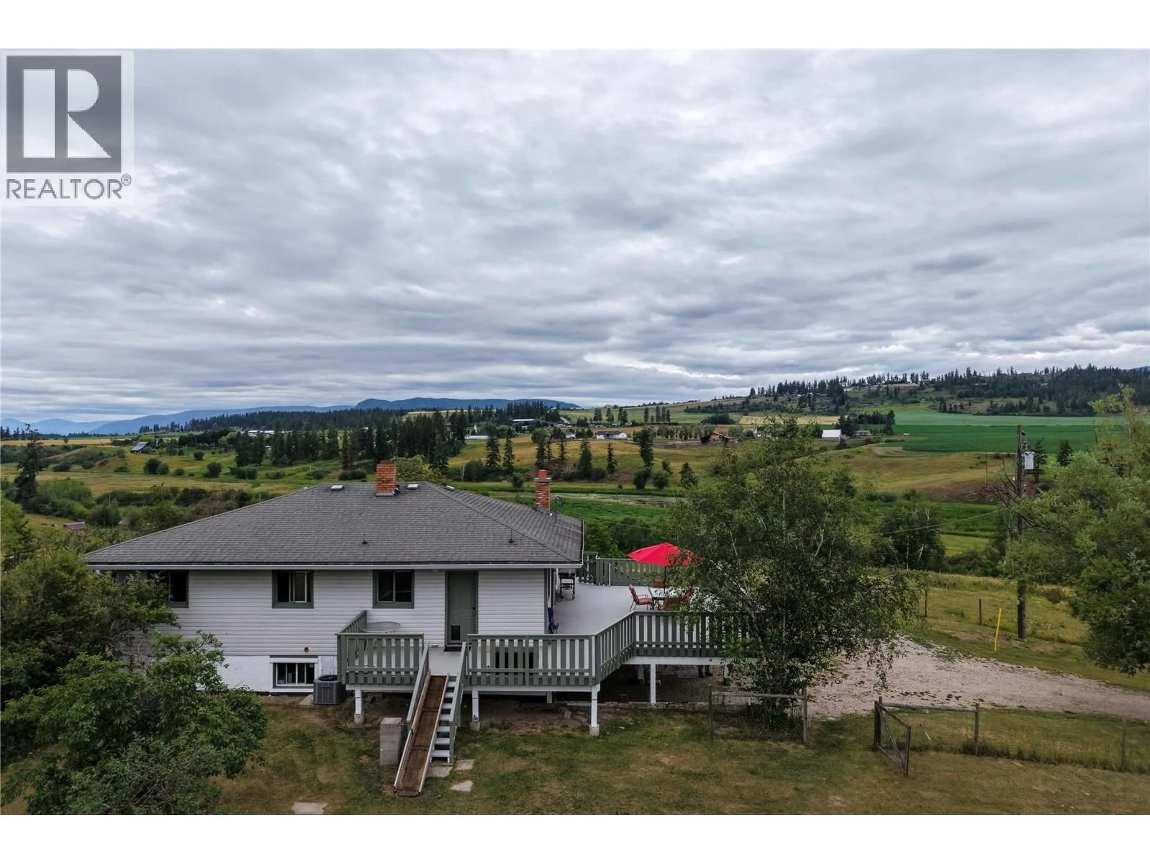 A pic from outside/outdoor area/front of a property/back of a property/a pic from drone, mountain view for 4852 STEPNEY ROAD, Spallumcheen British Columbia V0E1B8
