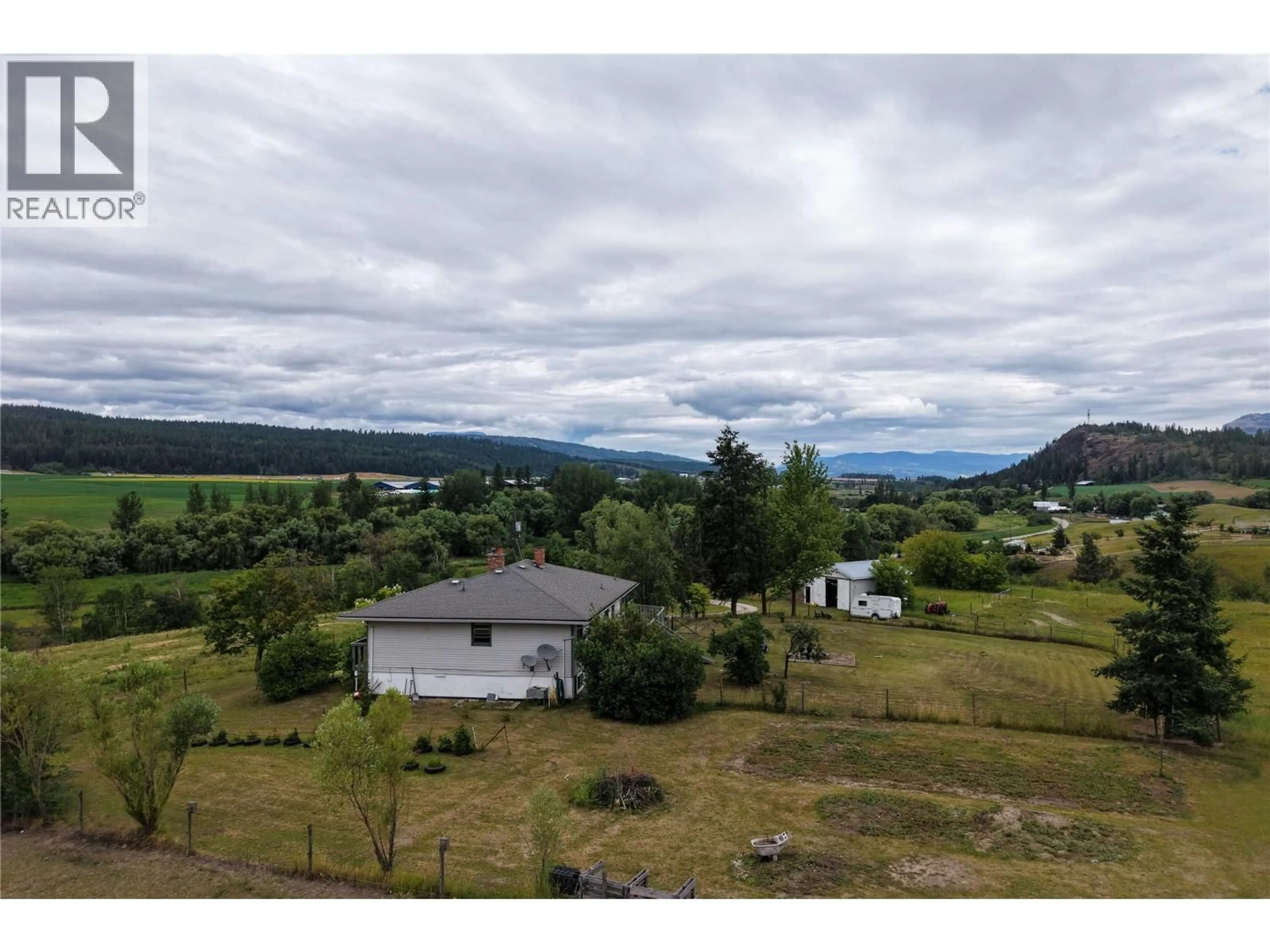 A pic from outside/outdoor area/front of a property/back of a property/a pic from drone, mountain view for 4852 STEPNEY ROAD, Spallumcheen British Columbia V0E1B8