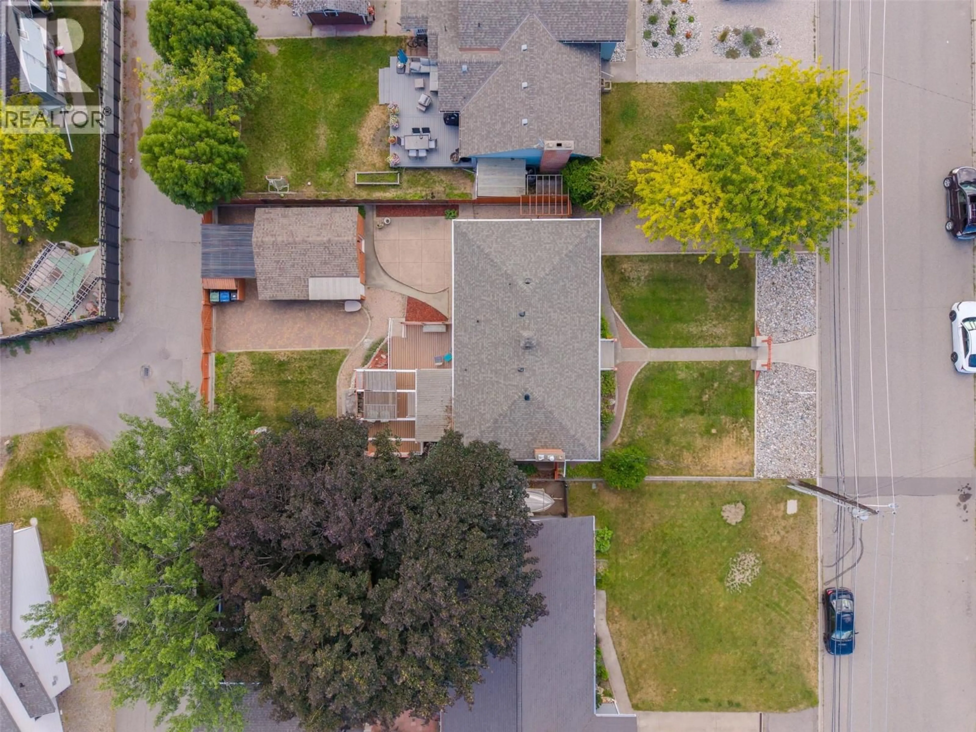 A pic from outside/outdoor area/front of a property/back of a property/a pic from drone, street for 76 HUTH AVENUE, Penticton British Columbia V2A2Z8
