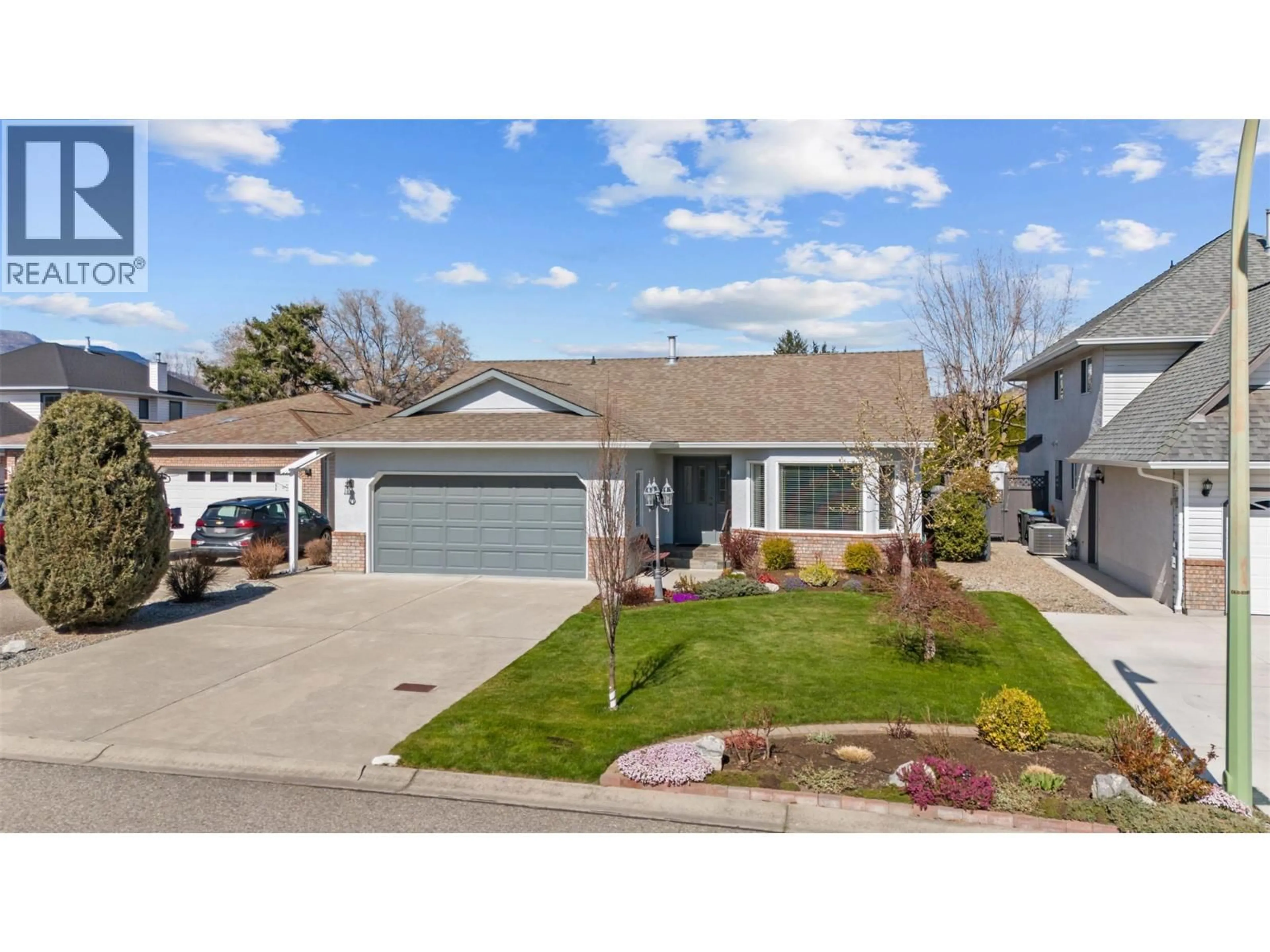 Home with vinyl exterior material, street for 1384 NELSON PLACE, Kelowna British Columbia V1Y9H4