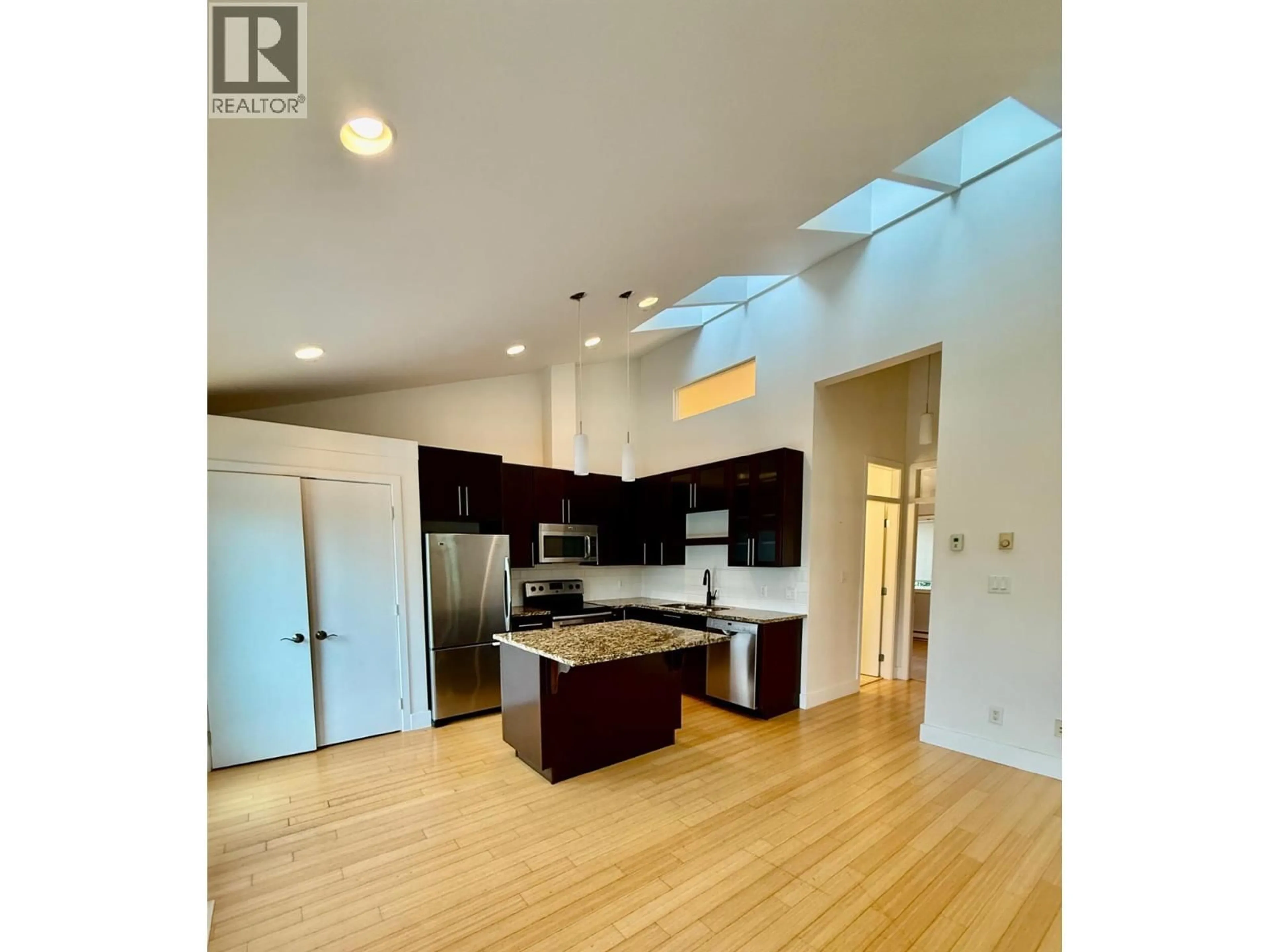 Open concept kitchen, wood/laminate floor for 8 - 702 FOURTH STREET, Nelson British Columbia V1L2S8