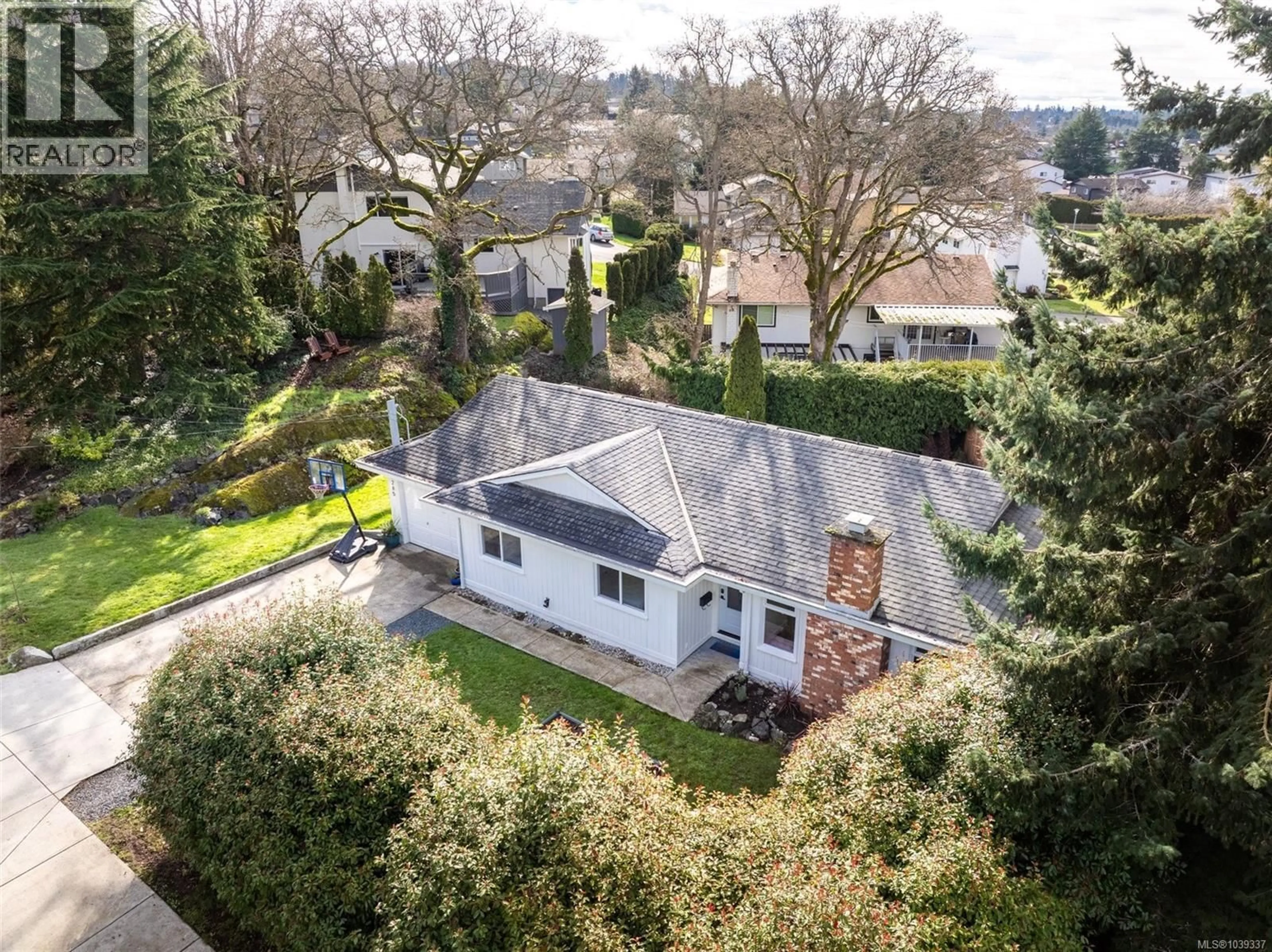 A pic from outside/outdoor area/front of a property/back of a property/a pic from drone, street for 4285 CAEN ROAD, Saanich British Columbia V8X3S5