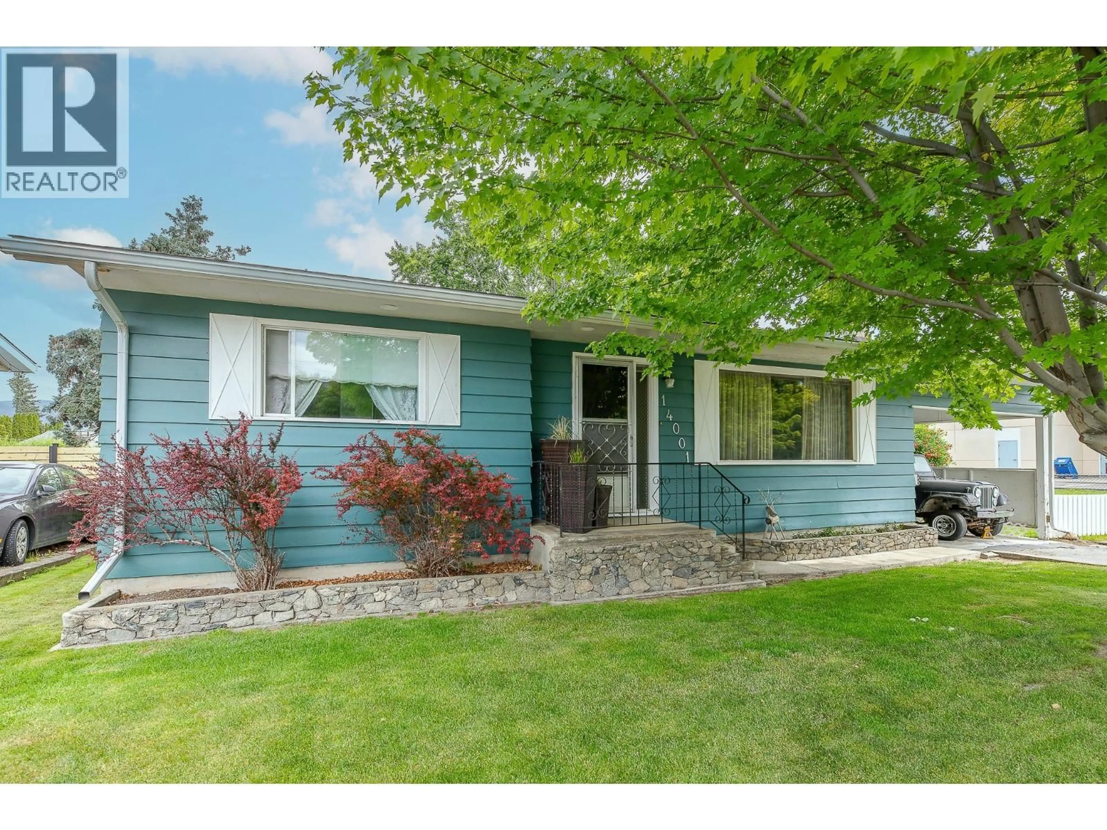 Home with vinyl exterior material, street for 14001 AMM AVENUE, Summerland British Columbia V0H1Z0