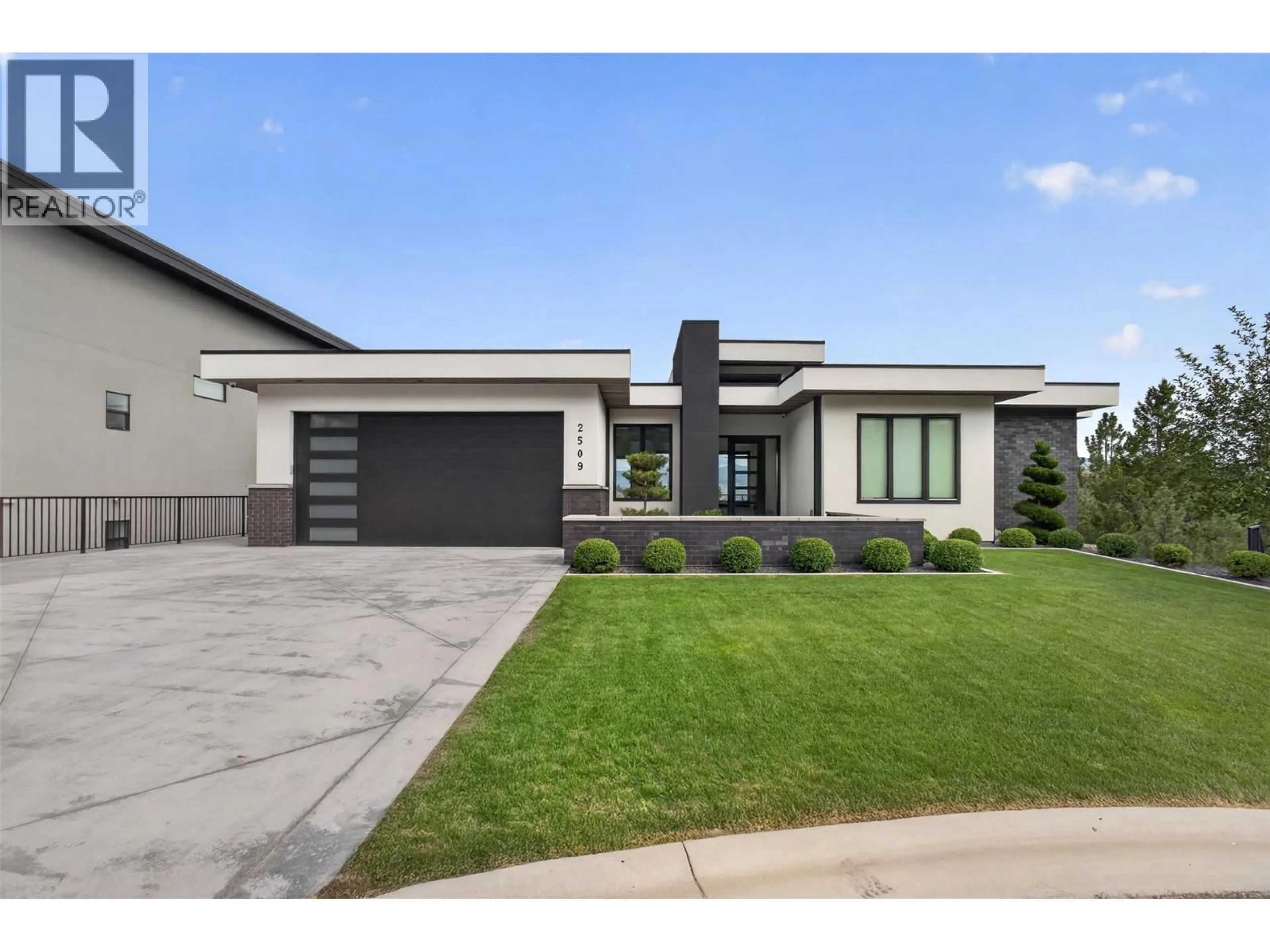 Home with brick exterior material, street for 2509 TALLUS HEIGHTS DRIVE, West Kelowna British Columbia V4T3M2