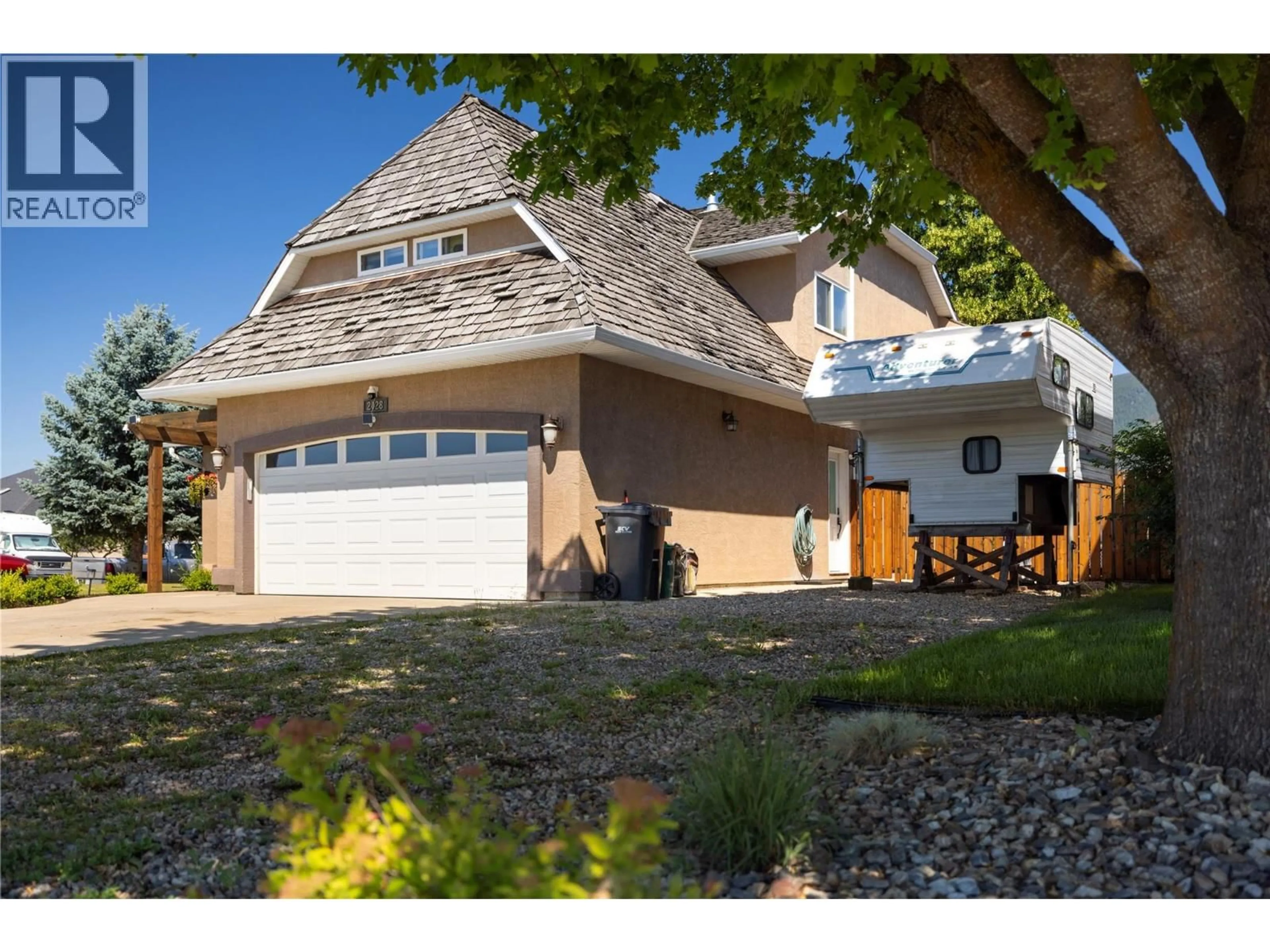 Home with vinyl exterior material, street for 2028 OKANAGAN STREET, Armstrong British Columbia V0E1B1