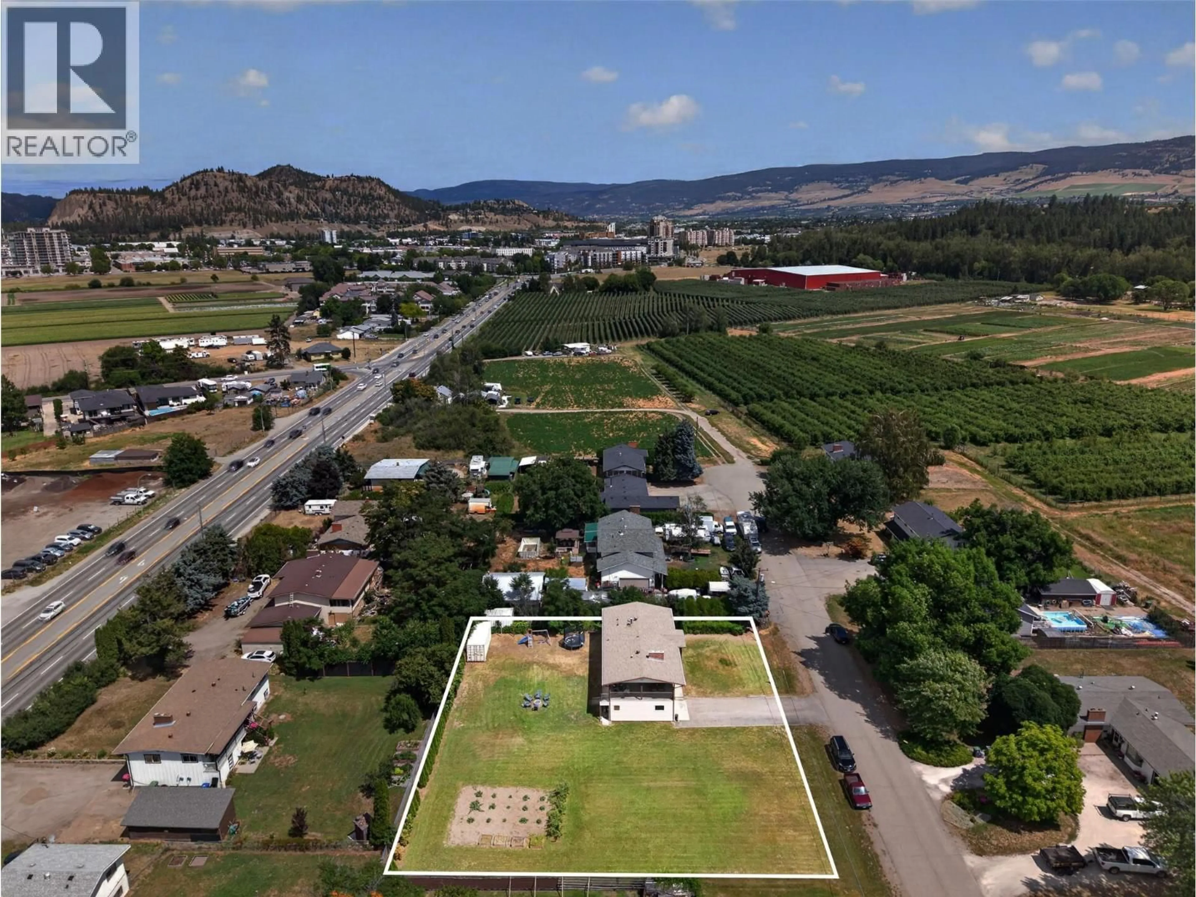 A pic from outside/outdoor area/front of a property/back of a property/a pic from drone, mountain view for 2550 BEETLESTONE DRIVE, Kelowna British Columbia V1W2G6