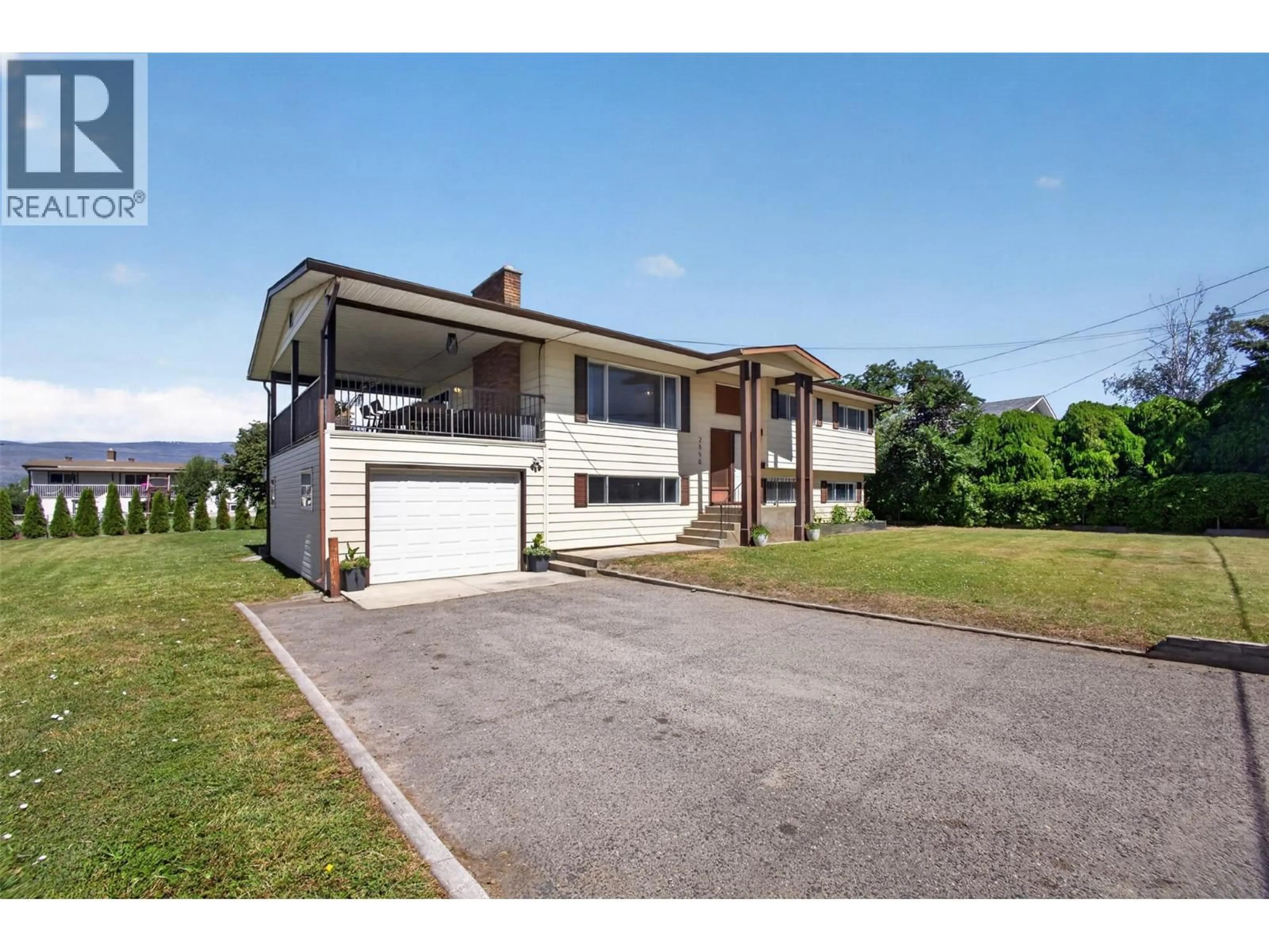 A pic from outside/outdoor area/front of a property/back of a property/a pic from drone, unknown for 2550 BEETLESTONE DRIVE, Kelowna British Columbia V1W2G6