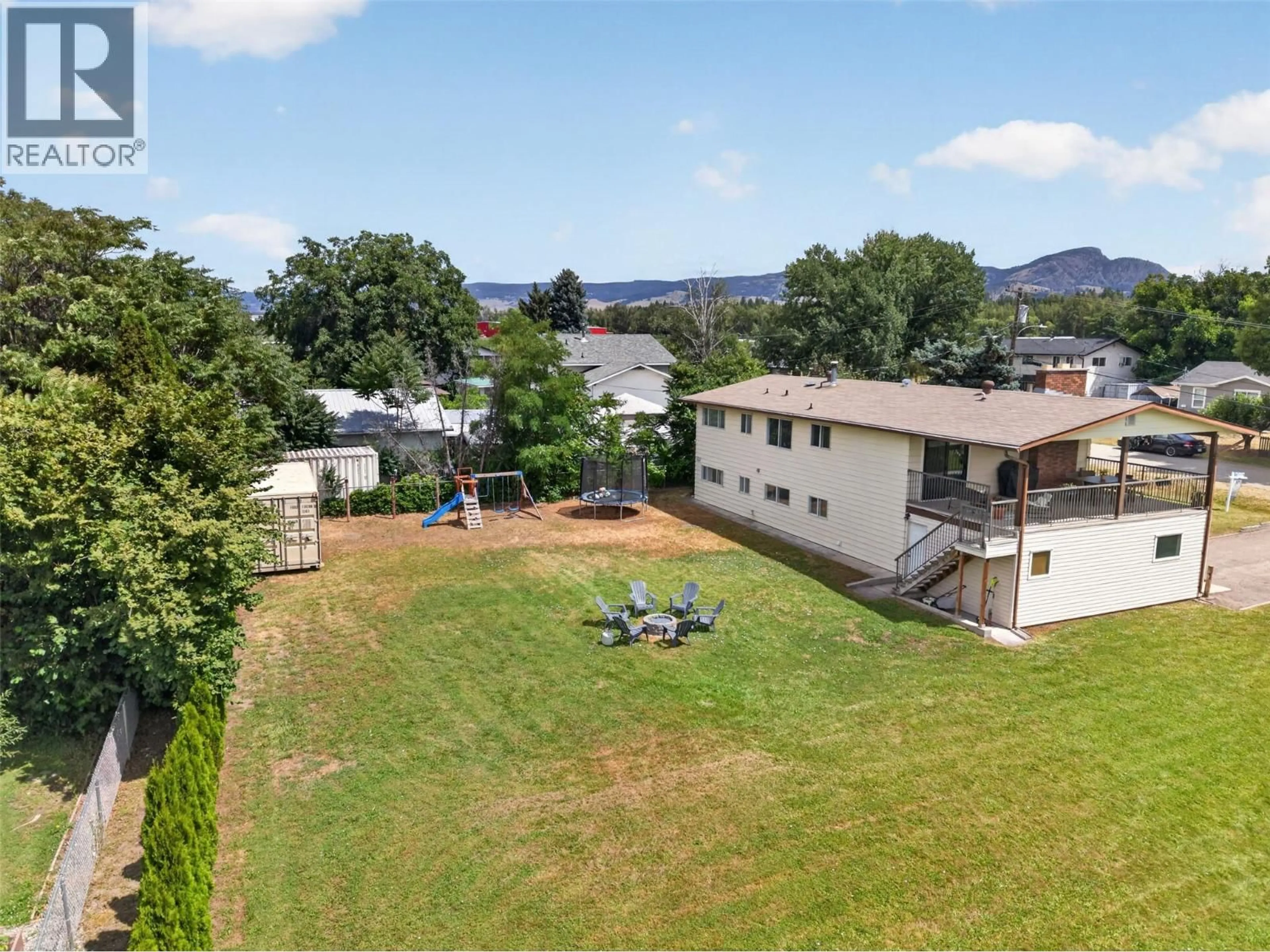 A pic from outside/outdoor area/front of a property/back of a property/a pic from drone, mountain view for 2550 BEETLESTONE DRIVE, Kelowna British Columbia V1W2G6