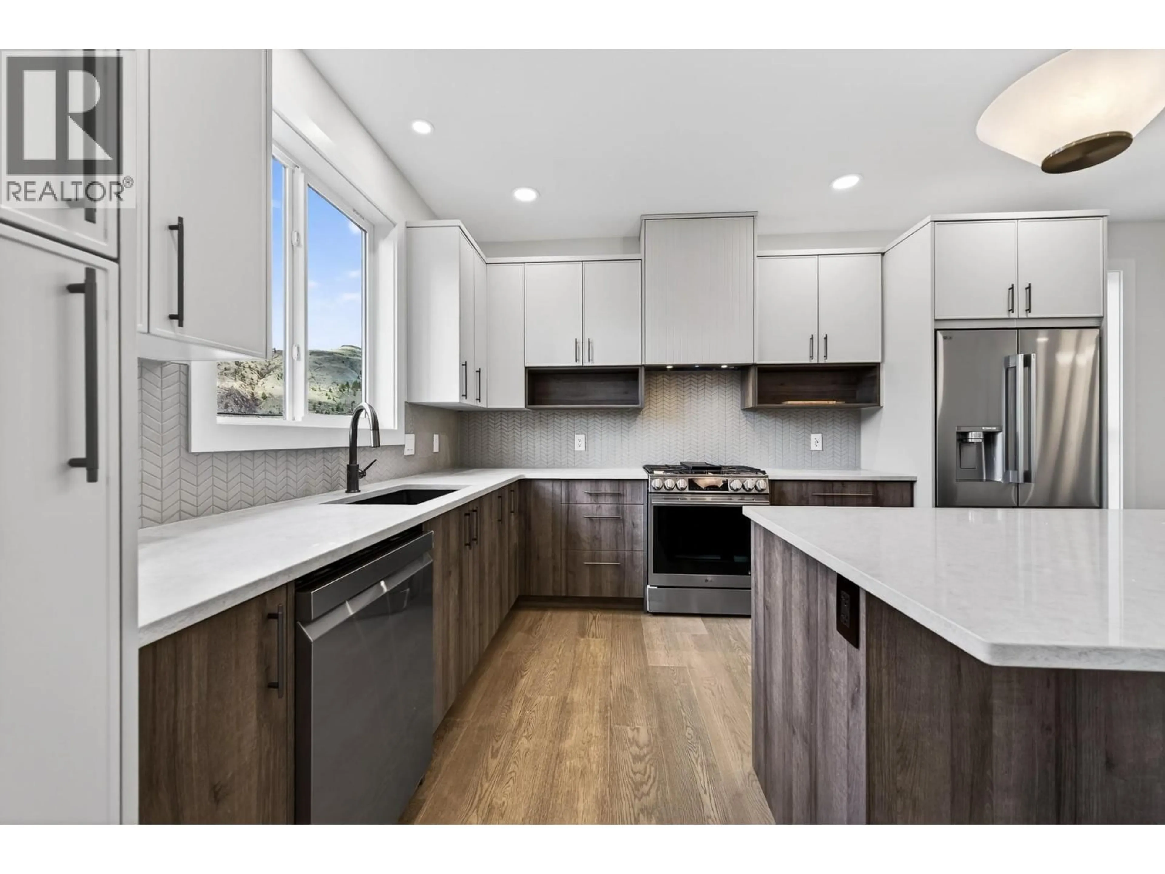 Open concept kitchen, wood/laminate floor for 3224 BANK ROAD, Kamloops British Columbia V2B6Z7