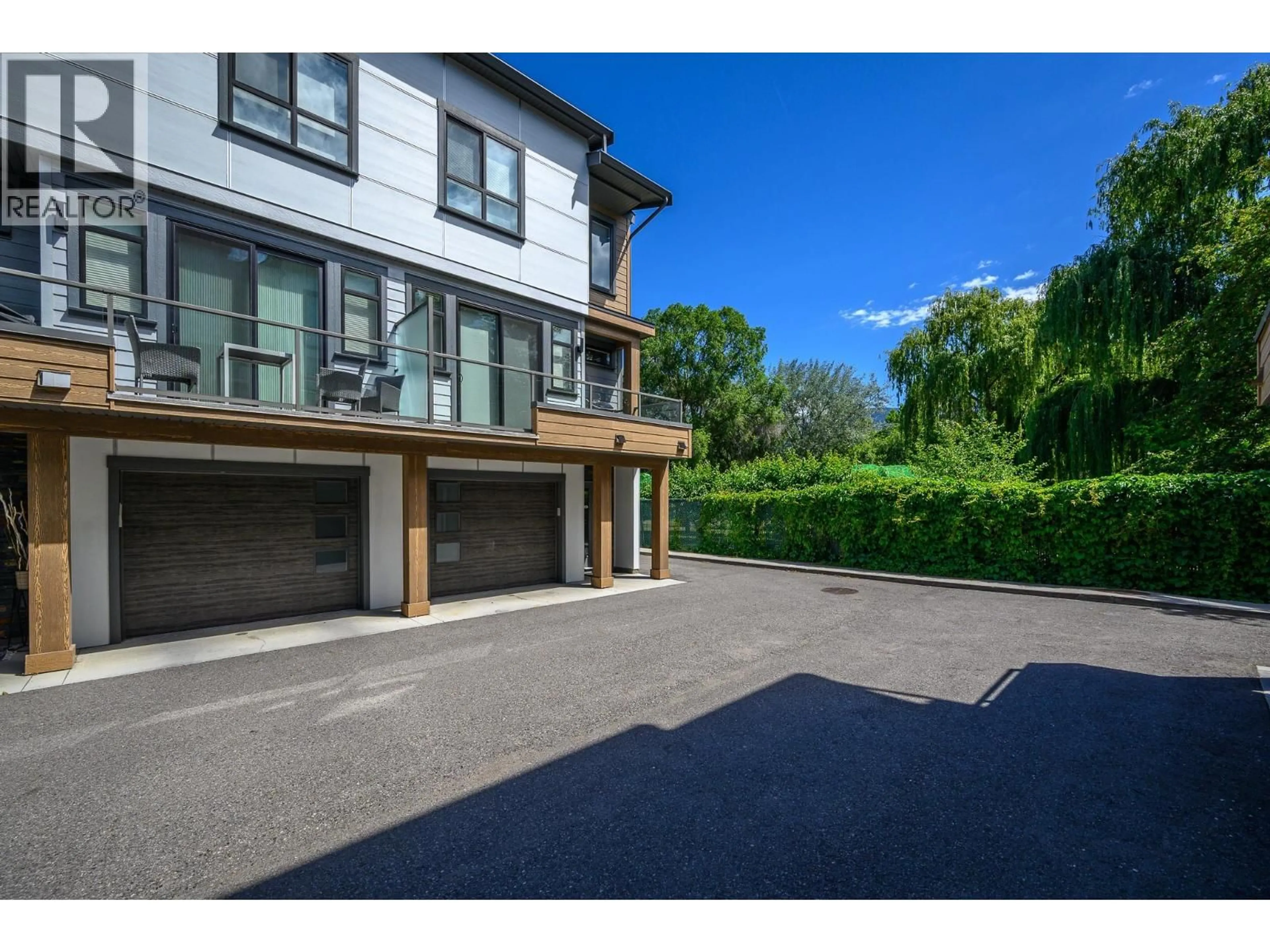 A pic from outside/outdoor area/front of a property/back of a property/a pic from drone, street for 301 - 11581 ROGERS ROAD, Lake Country British Columbia V4V1X8