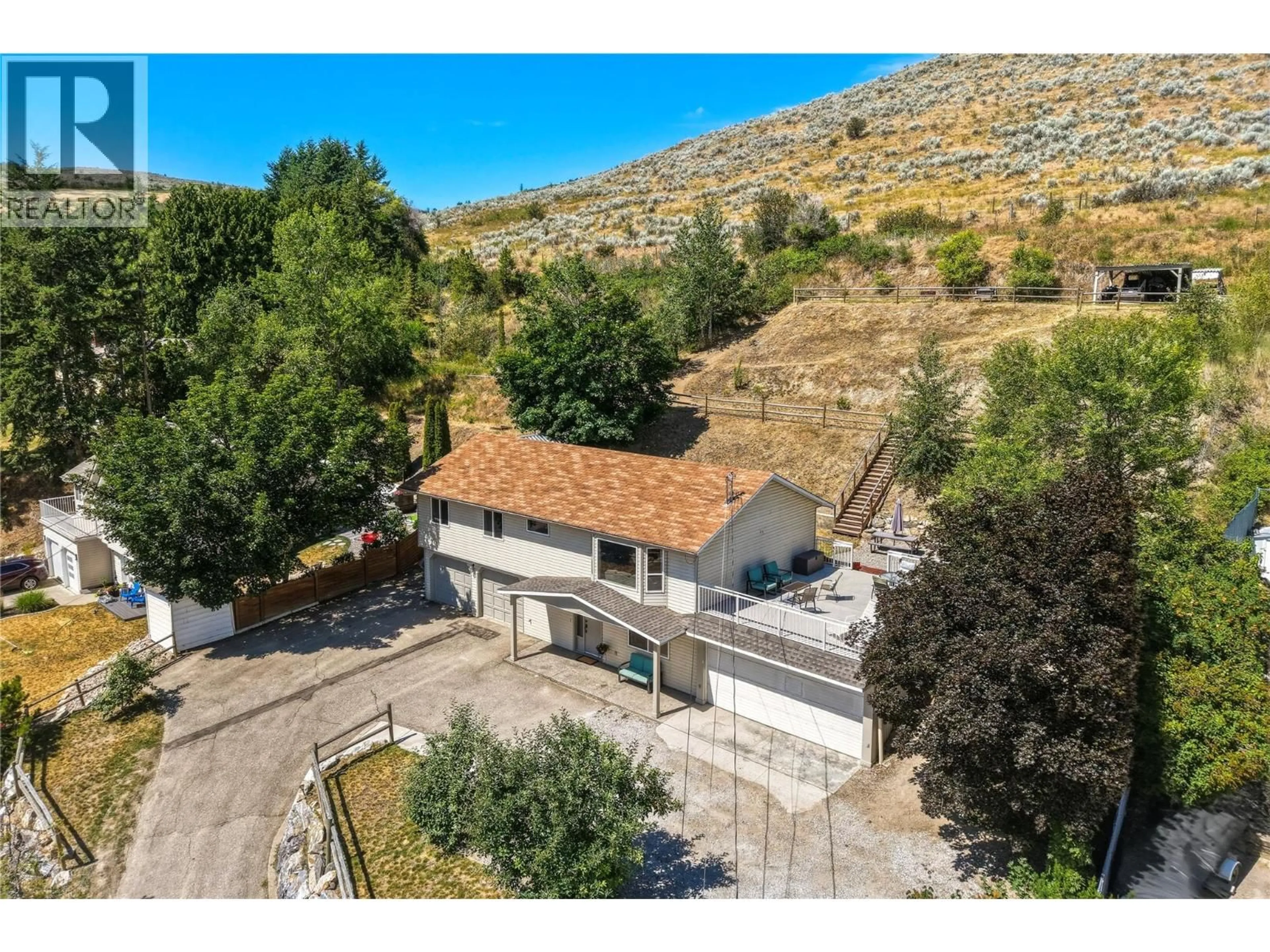 A pic from outside/outdoor area/front of a property/back of a property/a pic from drone, mountain view for 6512 BLUE JAY ROAD, Vernon British Columbia V1H1W4