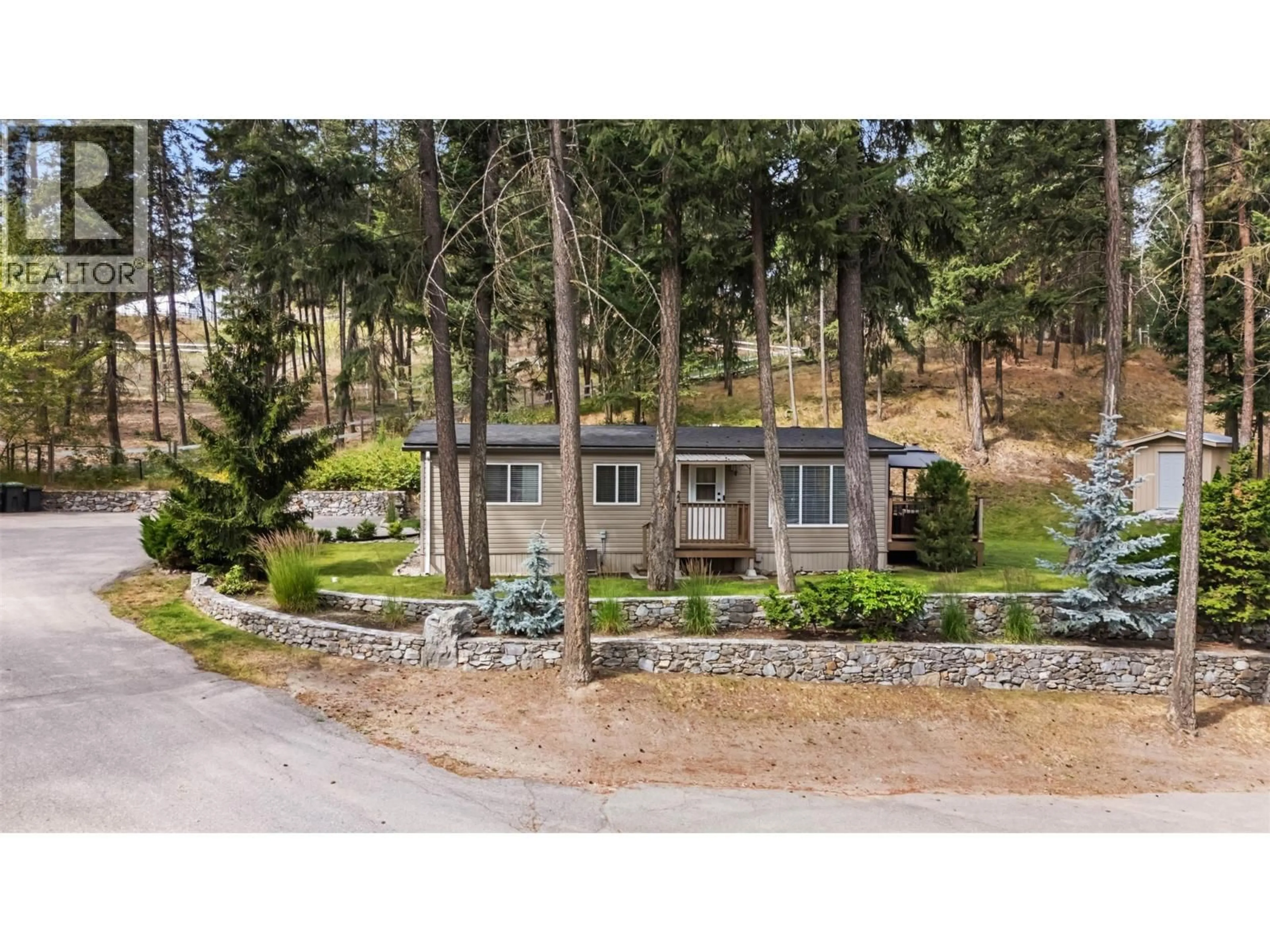 A pic from outside/outdoor area/front of a property/back of a property/a pic from drone, street for 22 - 4075 MCCLAIN ROAD, Kelowna British Columbia V1W4R4