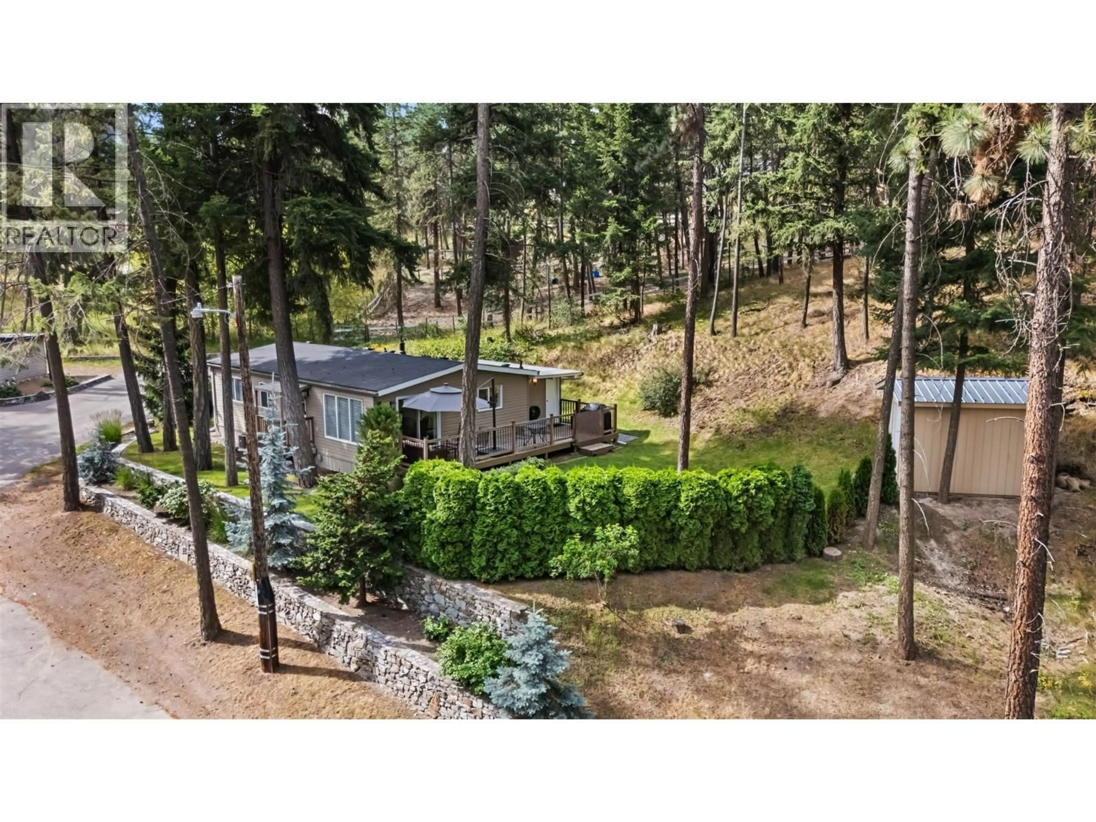 A pic from outside/outdoor area/front of a property/back of a property/a pic from drone, forest/trees view for 22 - 4075 MCCLAIN ROAD, Kelowna British Columbia V1W4R4
